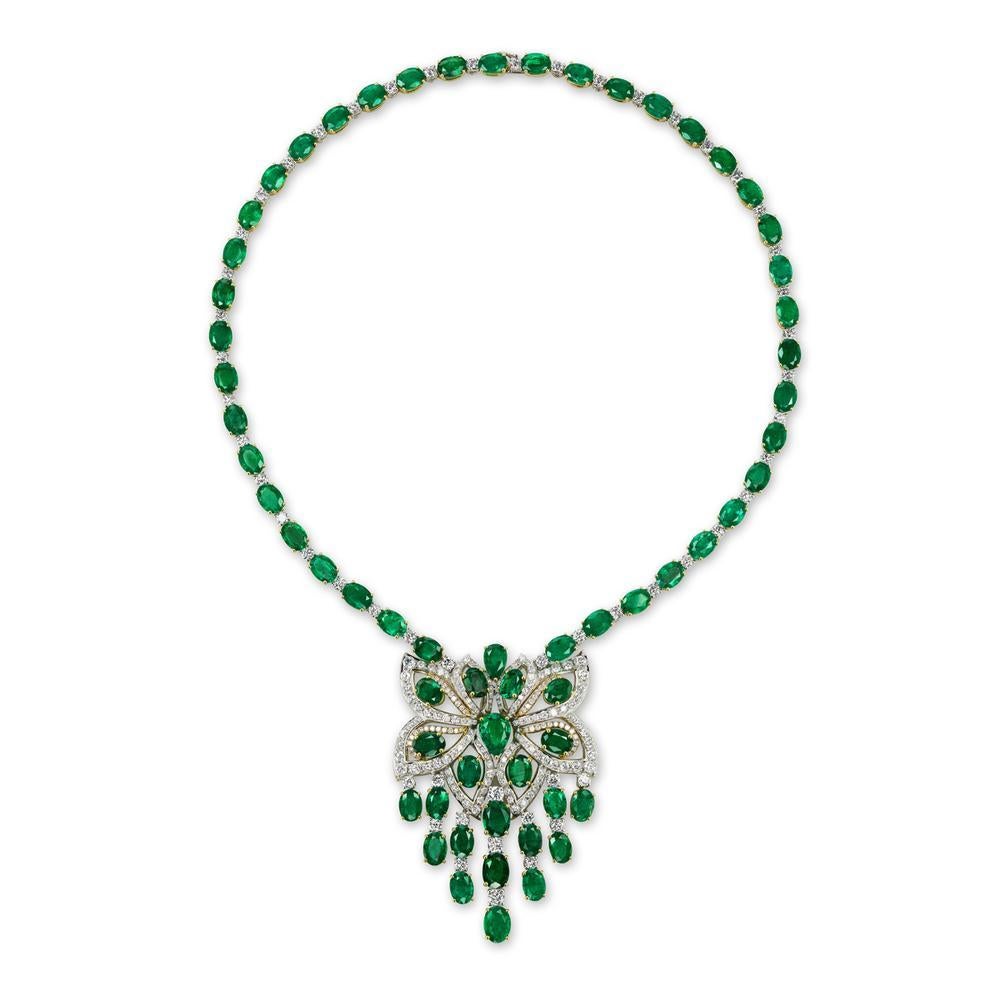 EMERALD AND DIAMOND NECKLACE
A beautiful airy design with great visual impact features a collection of perfectly matched Zambian emeralds. 
Item:	# 03028
Setting:	18K W/Y
Color Weight:	48.06 ct. of Emerald
Diamond Weight:	7.94 ct. of Diamonds

