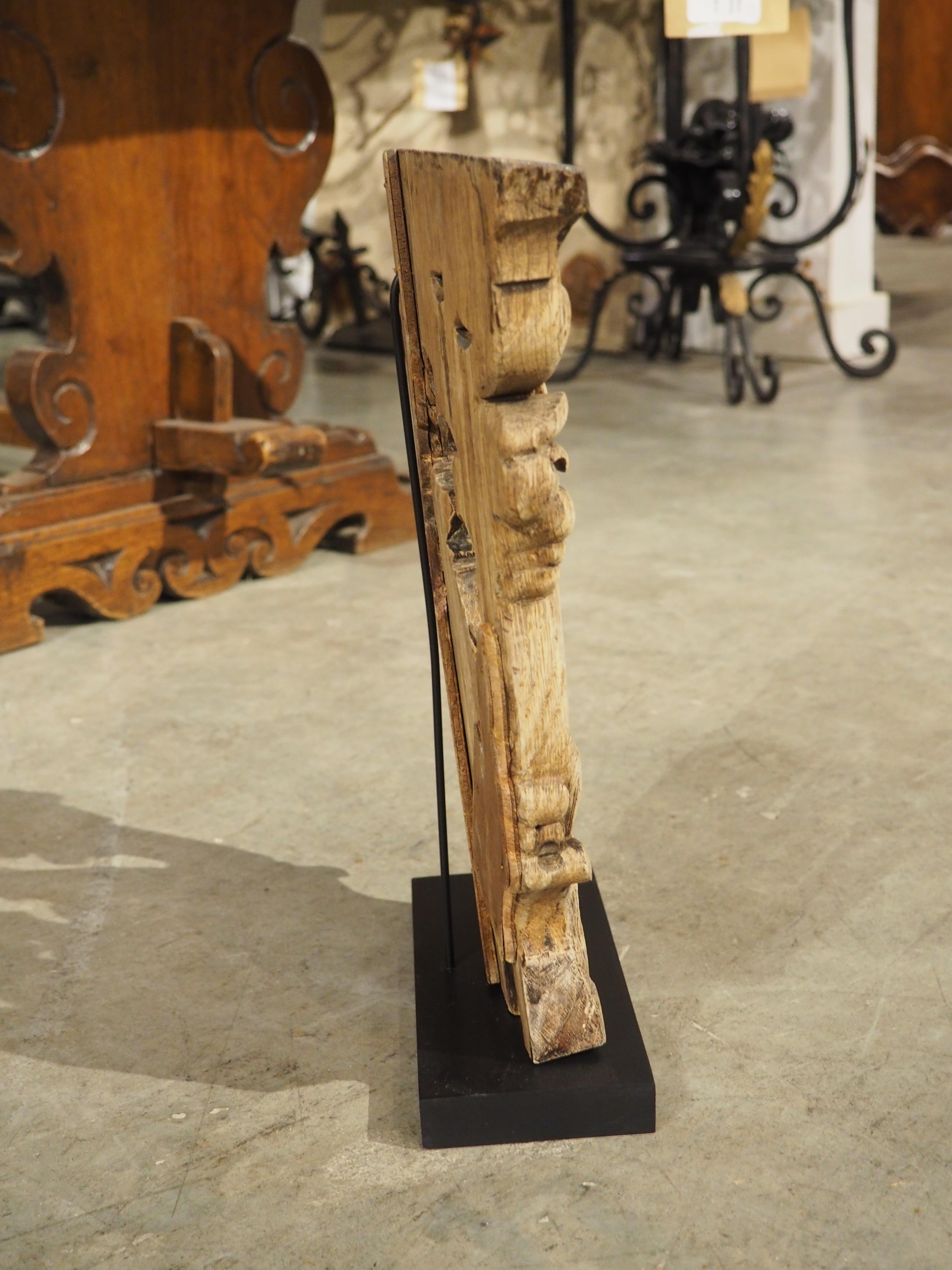Most likely originally part of a larger installation or highly carved furniture, this charming oak capital is from Flanders, which is part of modern-day Belgium. Hand-carved circa 1800, the original finish has been washed and the carving was mounted