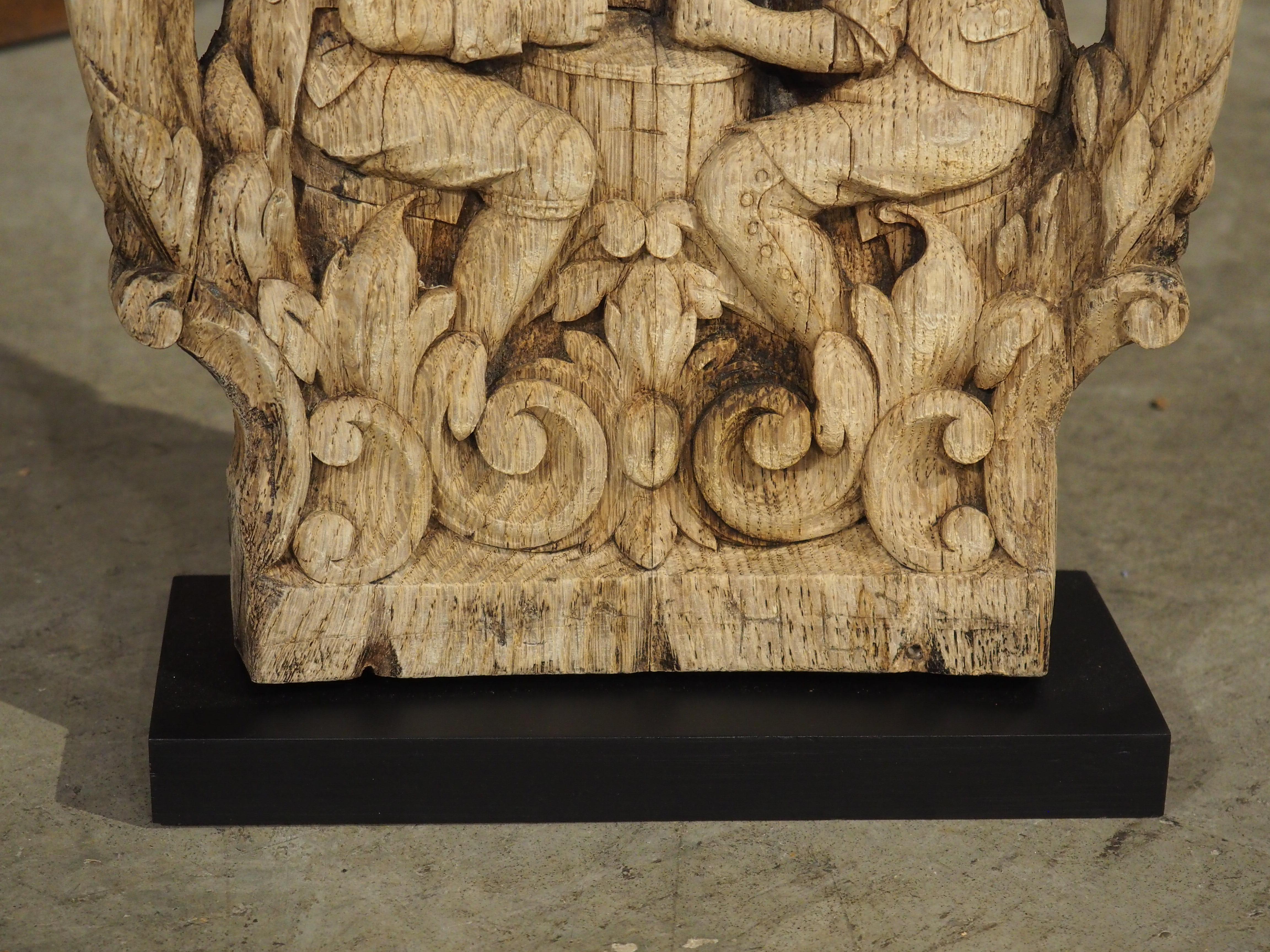 Hand-Carved Charming Flemish Washed Oak Capital, Two Men Drinking at a Barrel, Circa 1800 For Sale