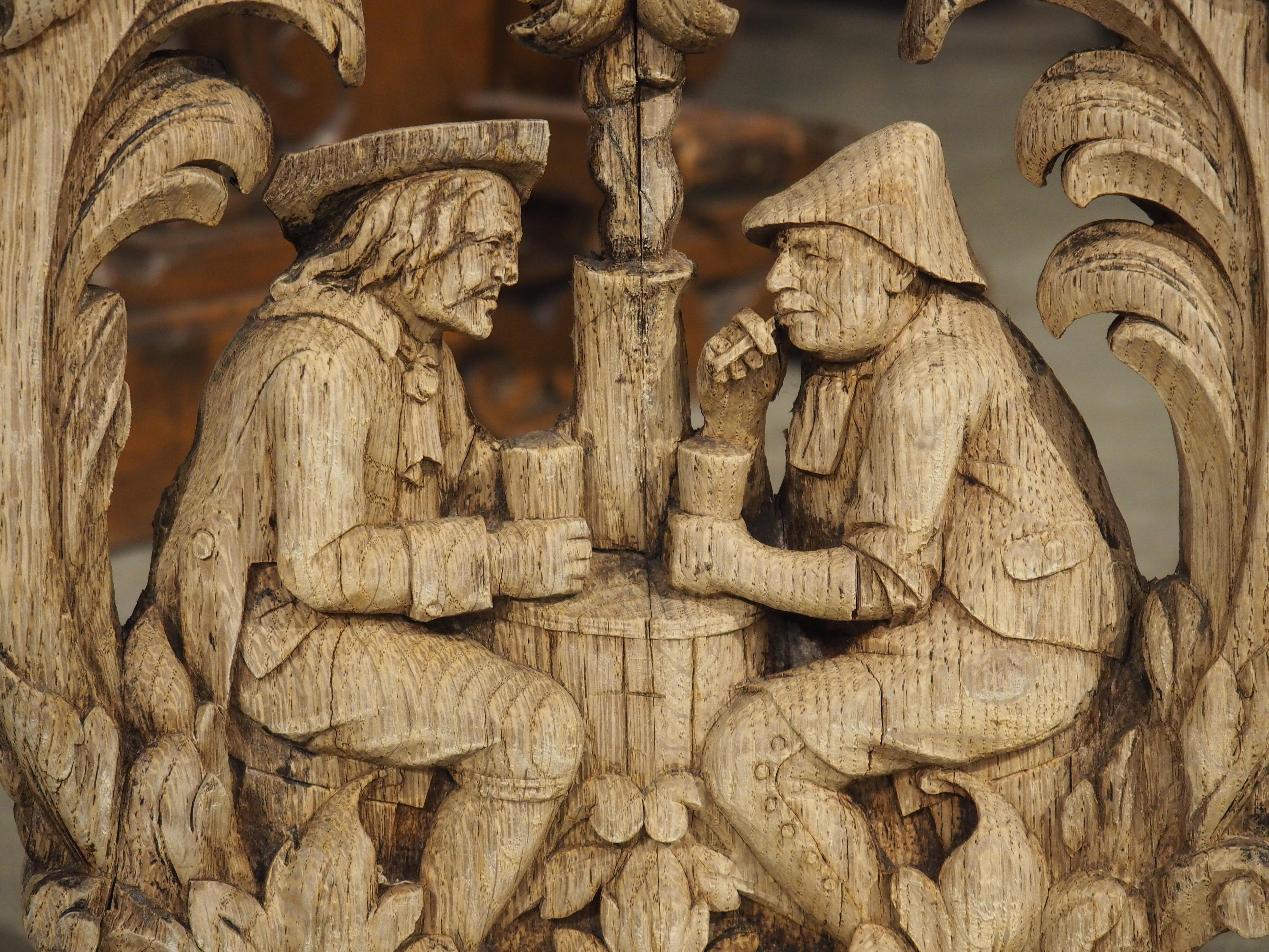 Early 19th Century Charming Flemish Washed Oak Capital, Two Men Drinking at a Barrel, Circa 1800 For Sale