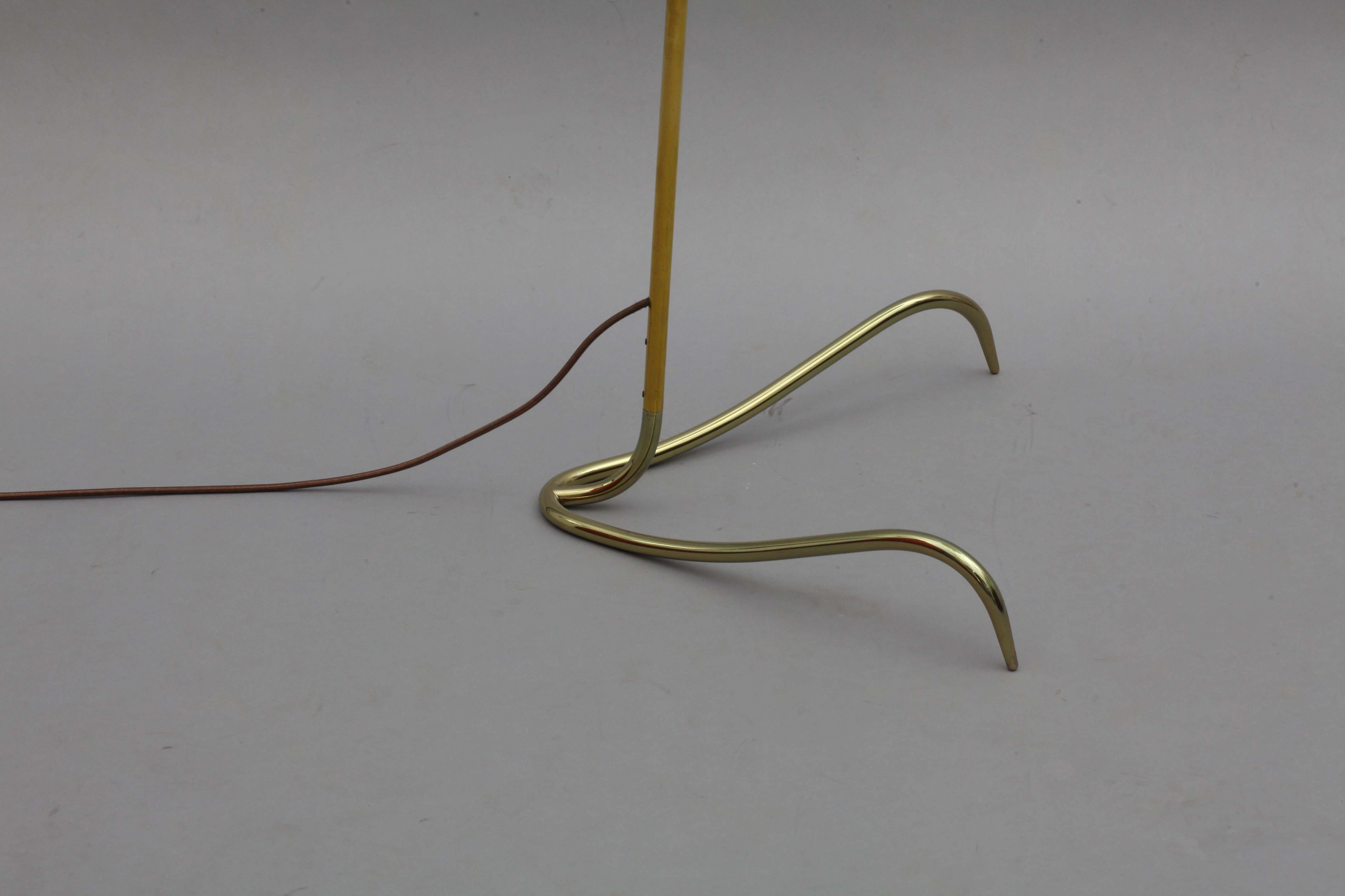 Floor lamp,
designed Rupert Nikoll
Vienna, 1950.
Brass base, brass stam, new fabric shade, wooden handle grip.
