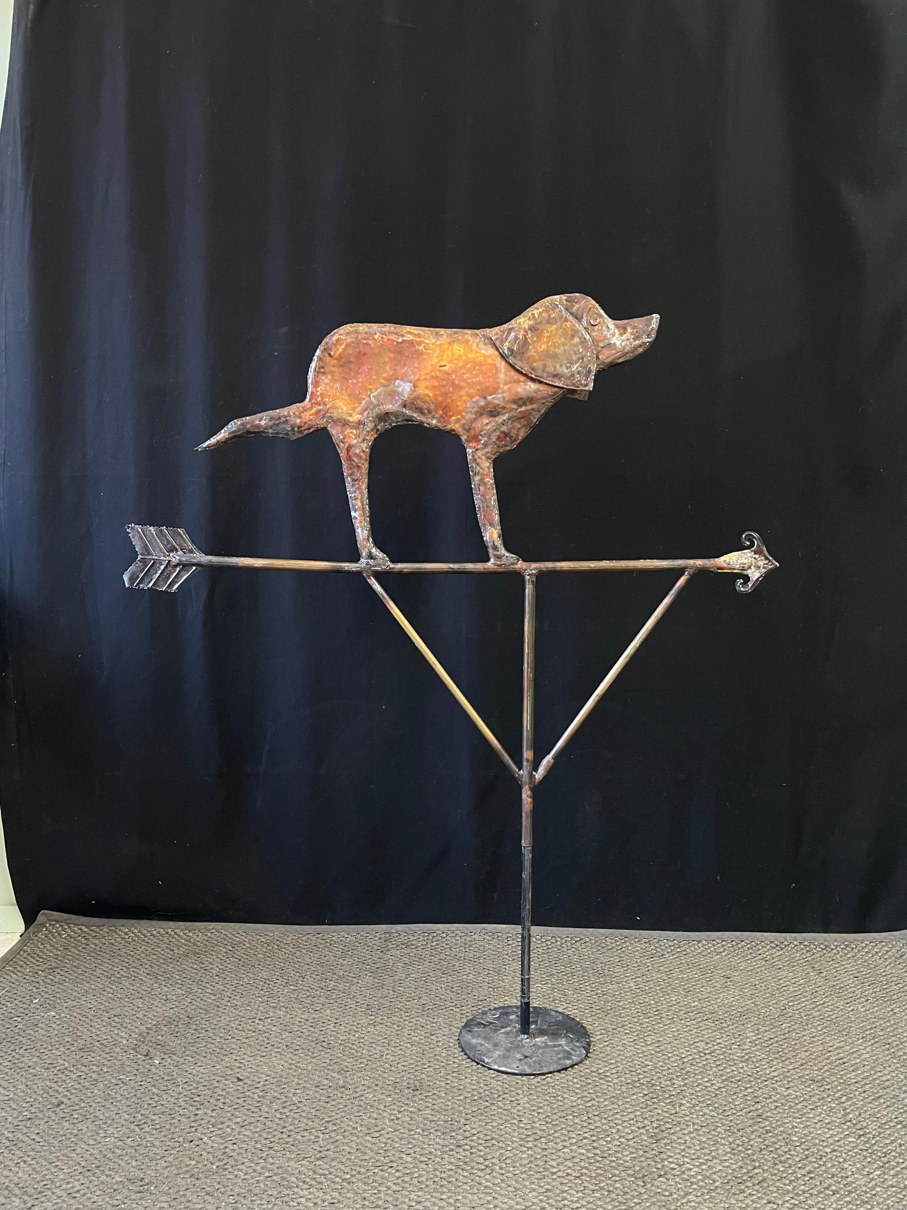 20th Century American Folk Art Weathervane artisan made from copper with an adorable dog perched atop the arrow. Amazing facial details and a natural aged patina bring all the charm to this one-of-a-kind New England piece of Americana! 

The