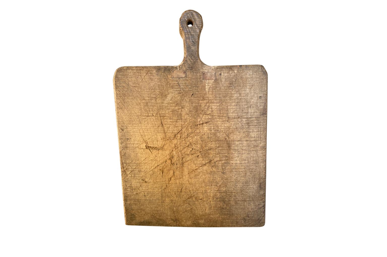 Charming French 19th Century Cutting Board in chestnut. A perfect kitchen accessory.