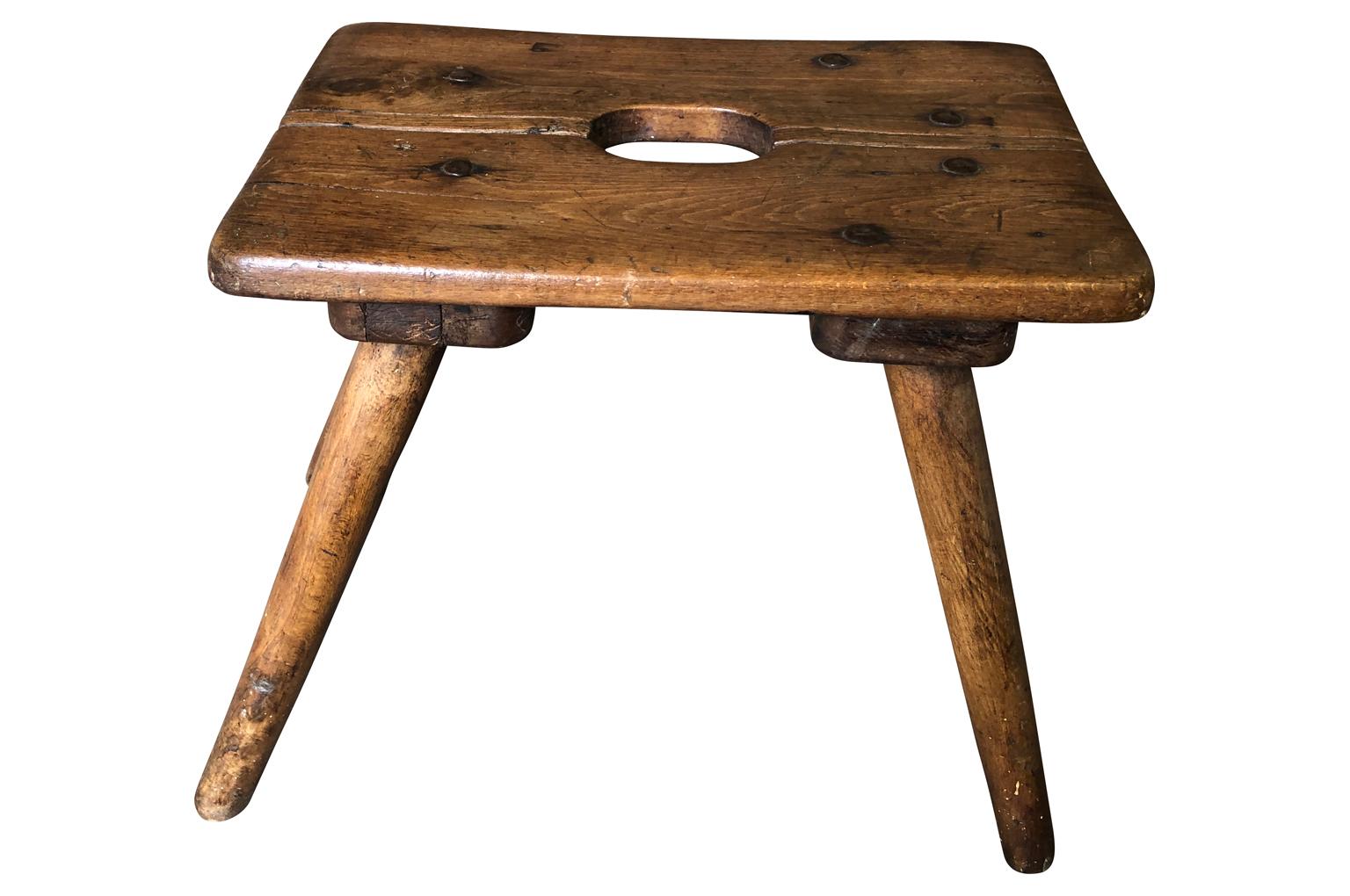 A very charming French 19th century stool in beech wood. Terrific patina. A great piece not only to sit on, but to display potted plants on as well.