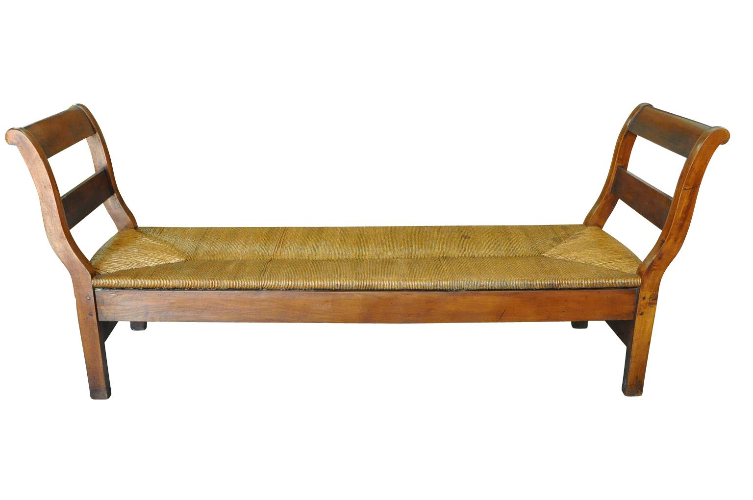 A delightful mid-19th century Lit De Repos - Banquette from the Provence region of France. Sturdily constructed from walnut with wonderful rush seating. A wonderful accent piece for any casually elegant surrounding.