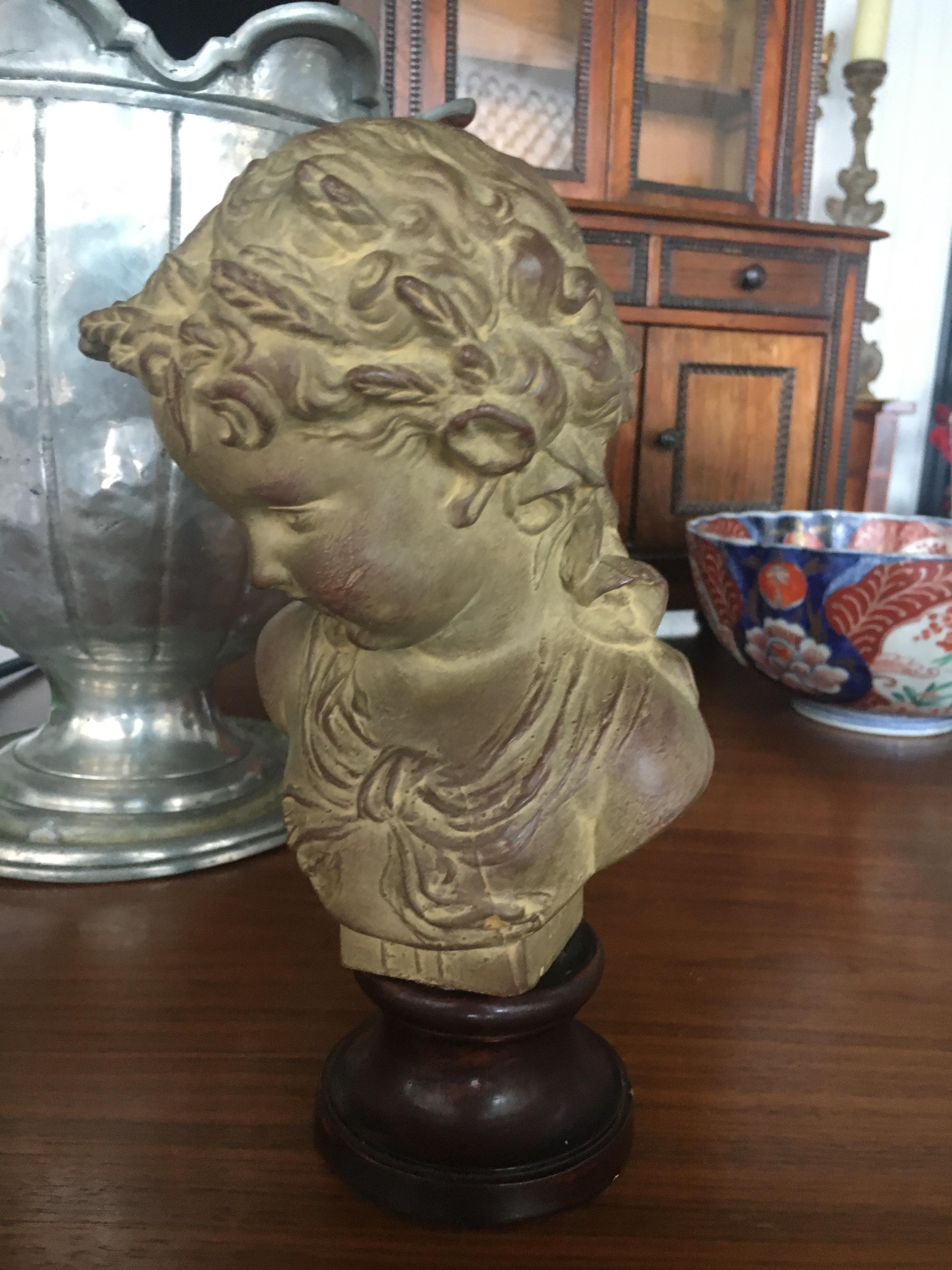 Neoclassical Charming French Terracotta Bust on Ebonized Wood Base Depicting Young Child. For Sale