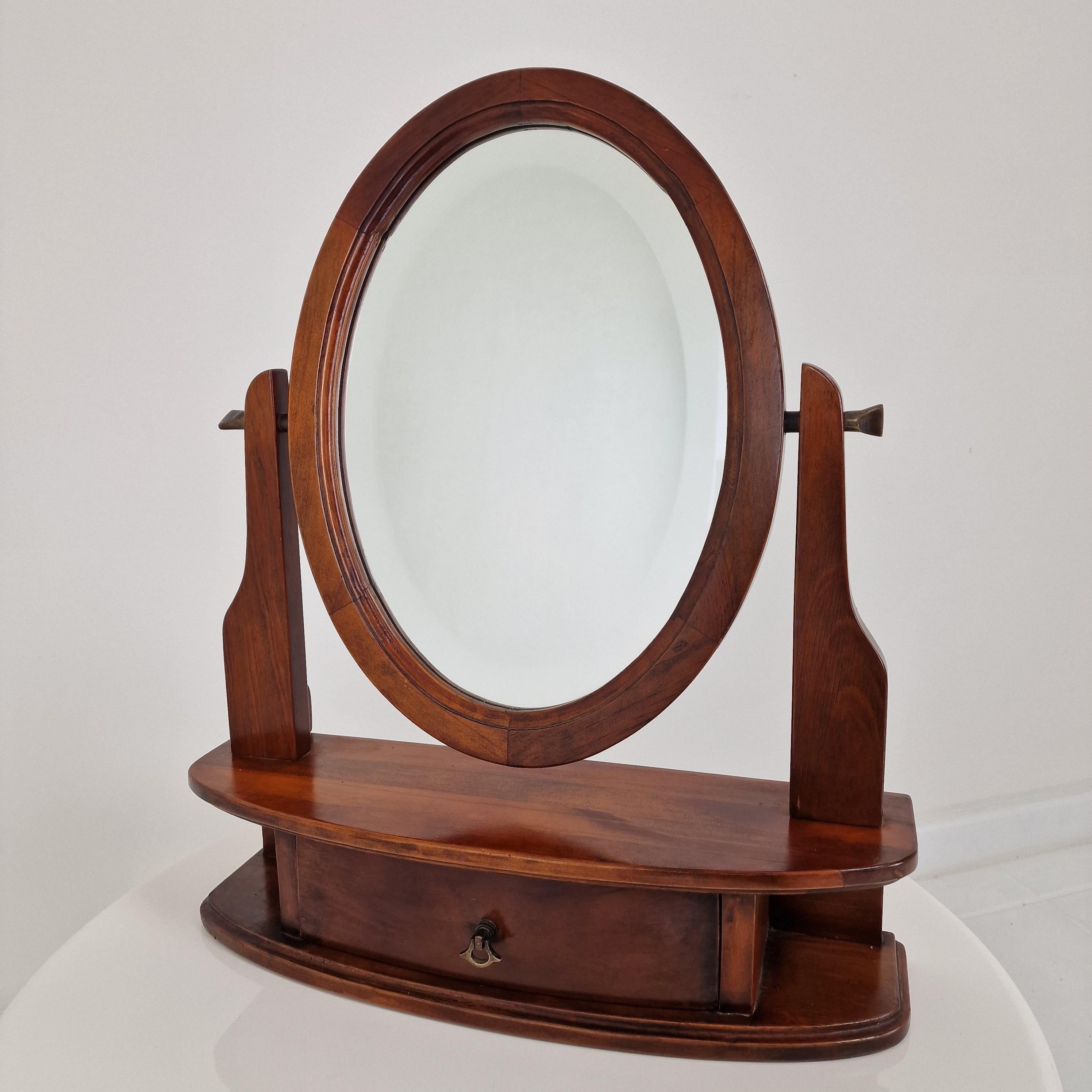 Add a touch of Parisian charm to your interior with this beautiful wooden vanity table.
Featuring an original French-style oval facet cut mirror.

With its elegant lines and solid wood craftsmanship, this piece combines vintage allure with everyday
