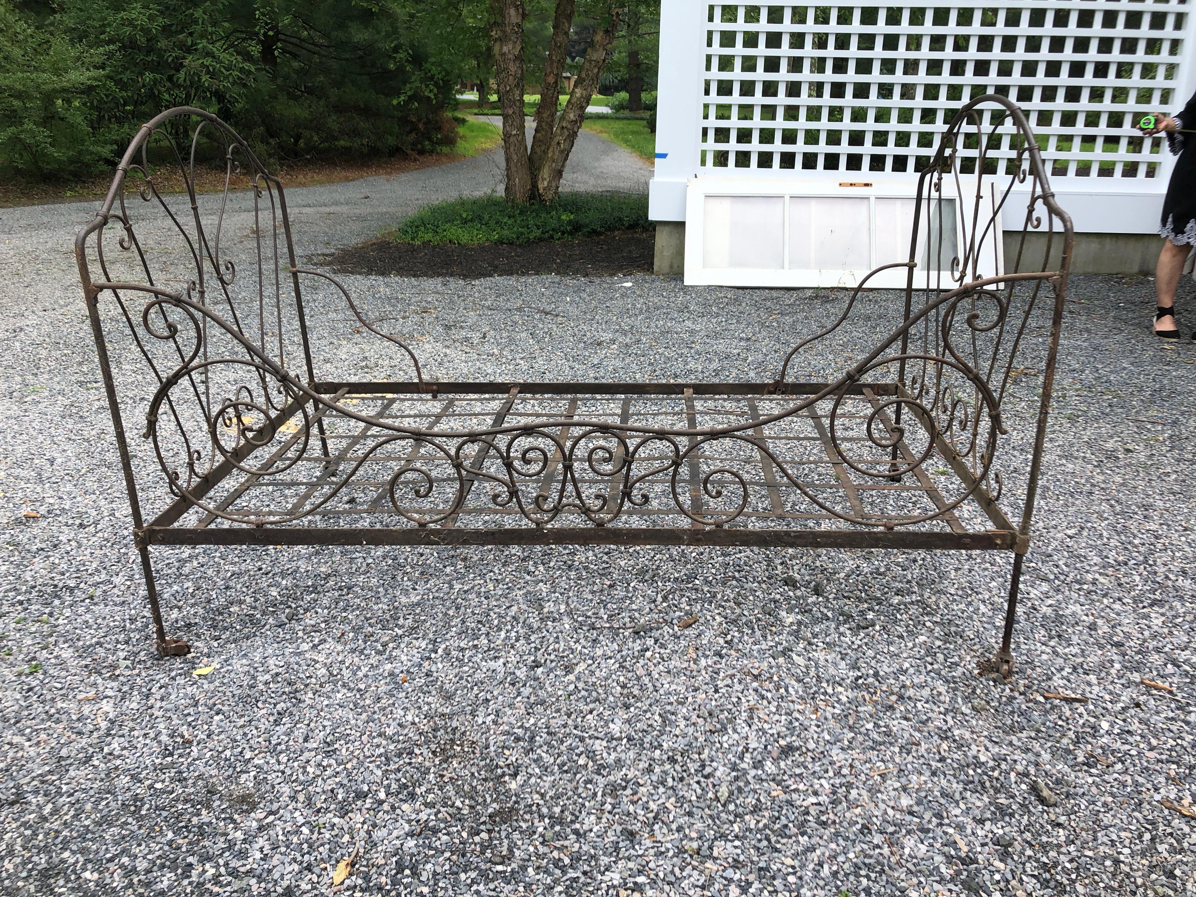 A classic vintage brown wrought iron French daybed with lovely curlicues and wheels on the legs. Measures: Seat height 12.5
Interior 43 D, 72.5 L.