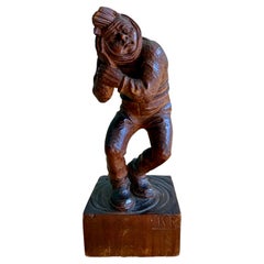 Encantadora escultura de madera tallada a mano de un hombre con dolor de muelas, firmada "K.R.".