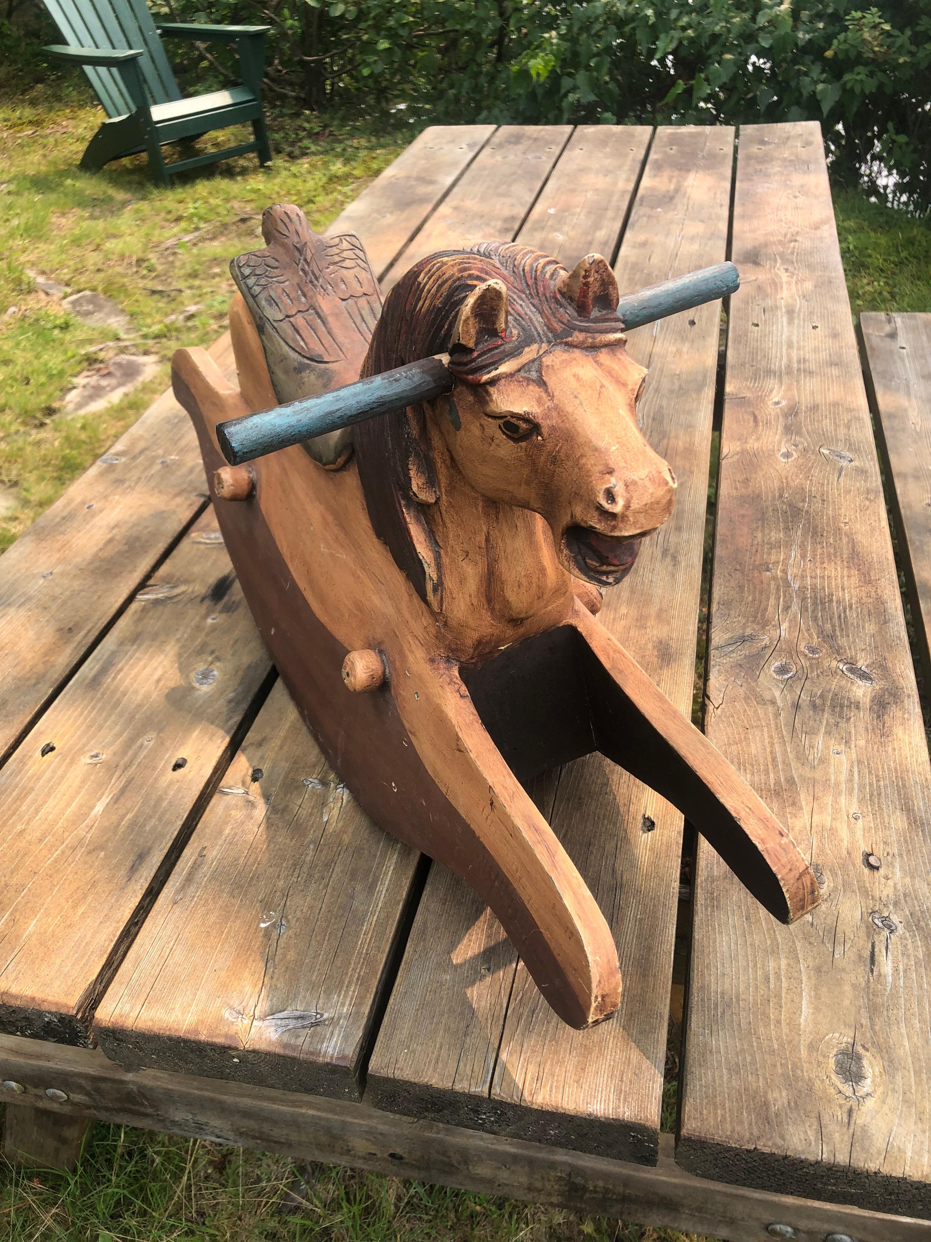 carved wooden rocking horse