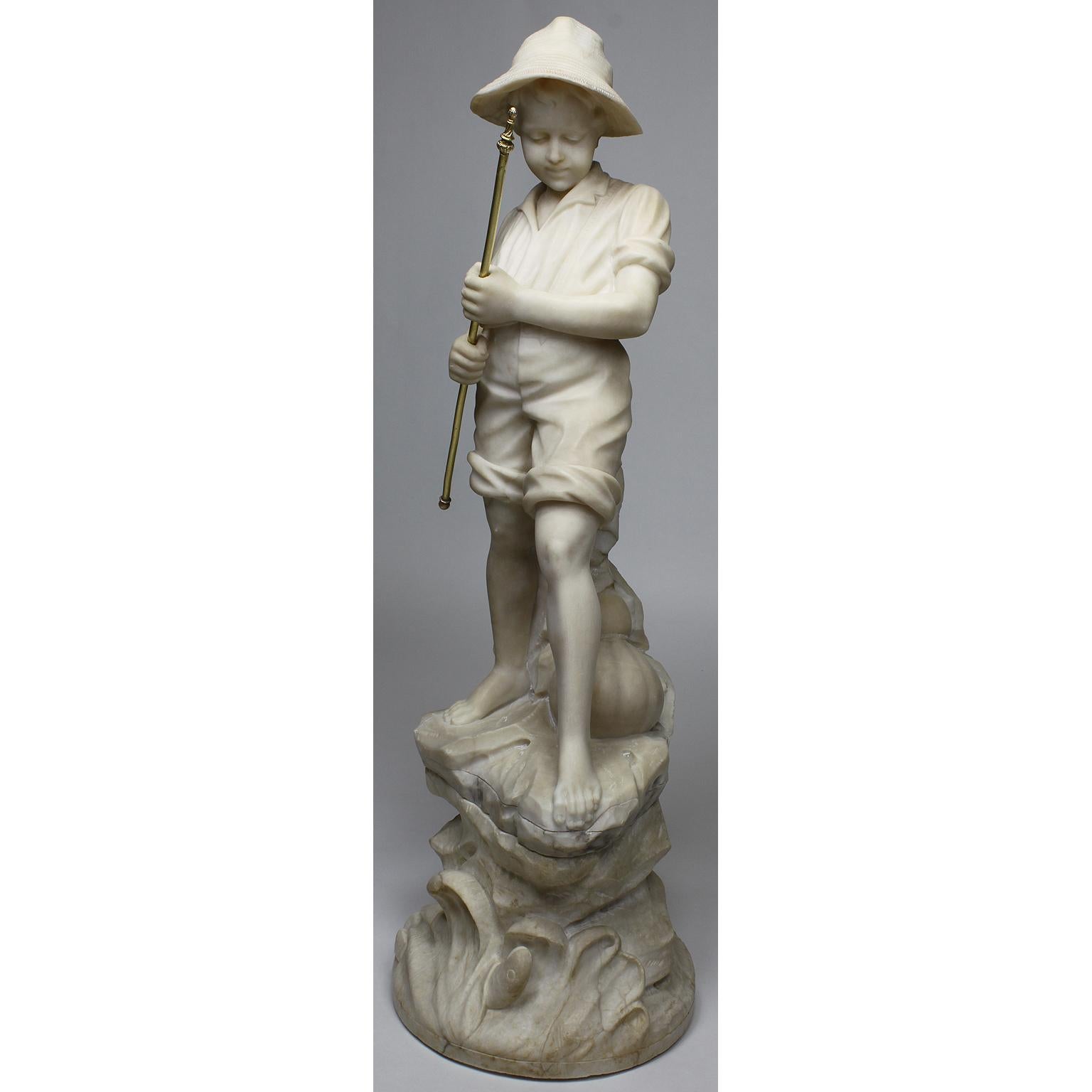A charming Italian 19th-20th century carved alabaster figure of a fisher boy. The young boy wearing a blouse, with his pant legs rolled up to his knees and a straw hat, standing on a Rocky Outcrop and holding a gilt metal fishing rod. Unsigned,