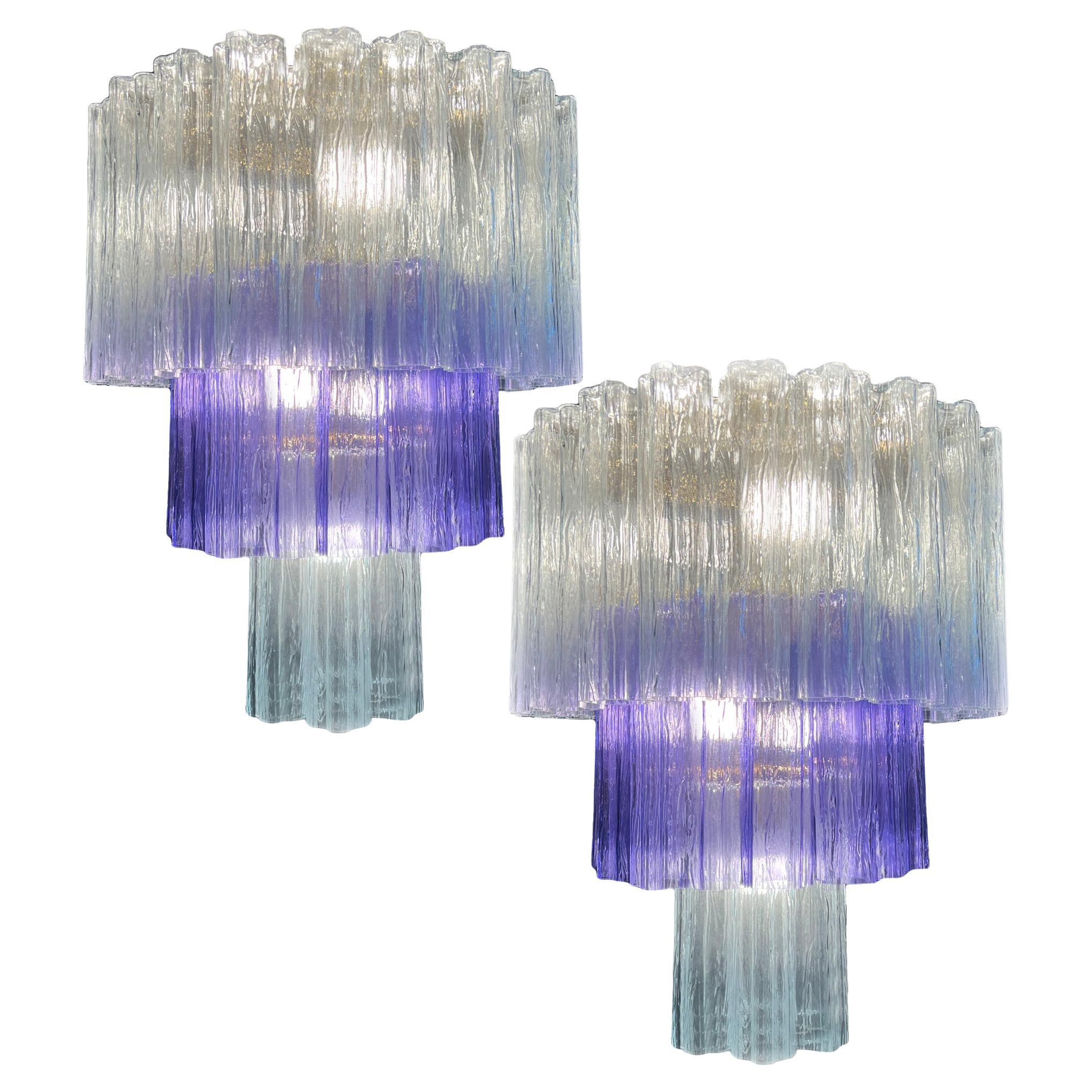 Stunning pair Murano chandeliers. The amethyst color elegantly reflects the light alternating harmoniously with the clear glass. The height without chain is 112 cm. It can be made to the dimensions requested by the customer.