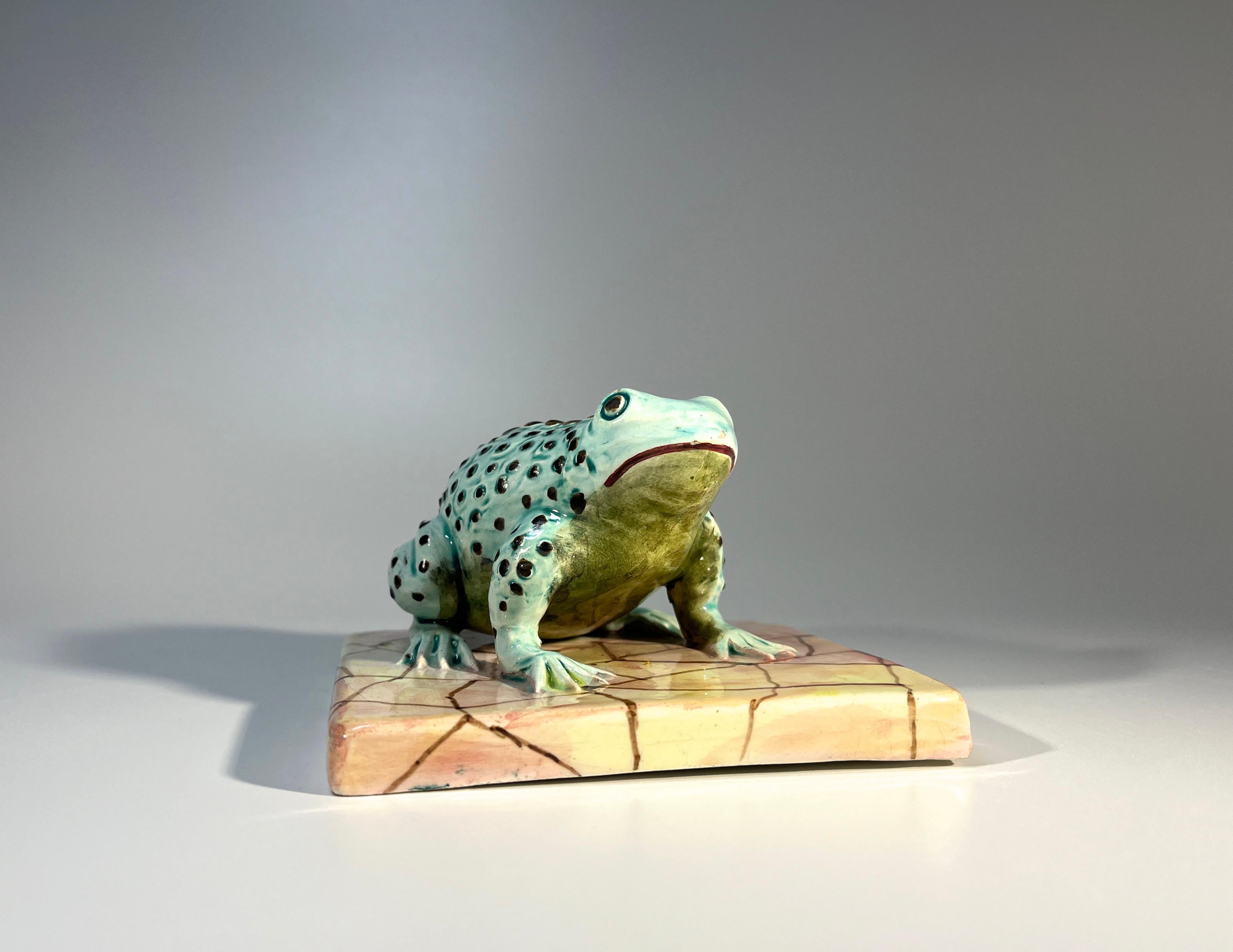 Charming Italian ceramic toad sitting on a tile 
Four inch square tile with a superbly tactile blue toad atop
Understood to have been privately commissioned 
Circa 1960's
Signed Italy
Height 4 inch, Width 4 inch, Depth 2.5 inch
In excellent