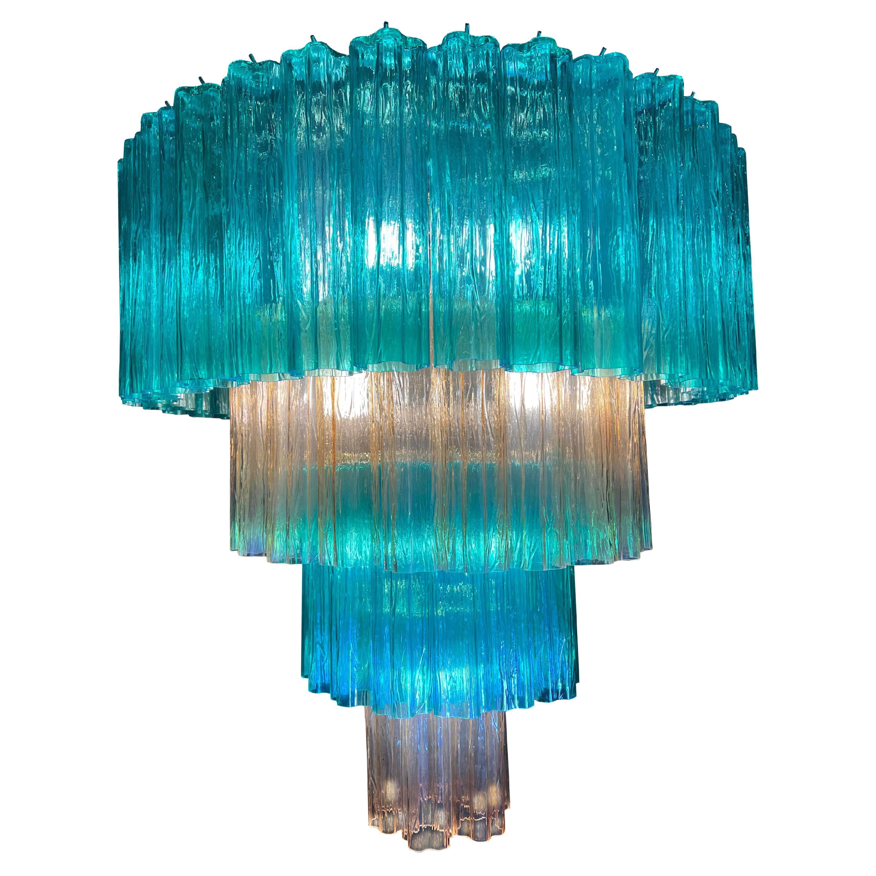 Pair Stunning Murano chandeliers. The sophisticated pink and blue color elegantly reflects the light. The height without chain is 112 cm. It can be made to the dimensions requested by the customer.
