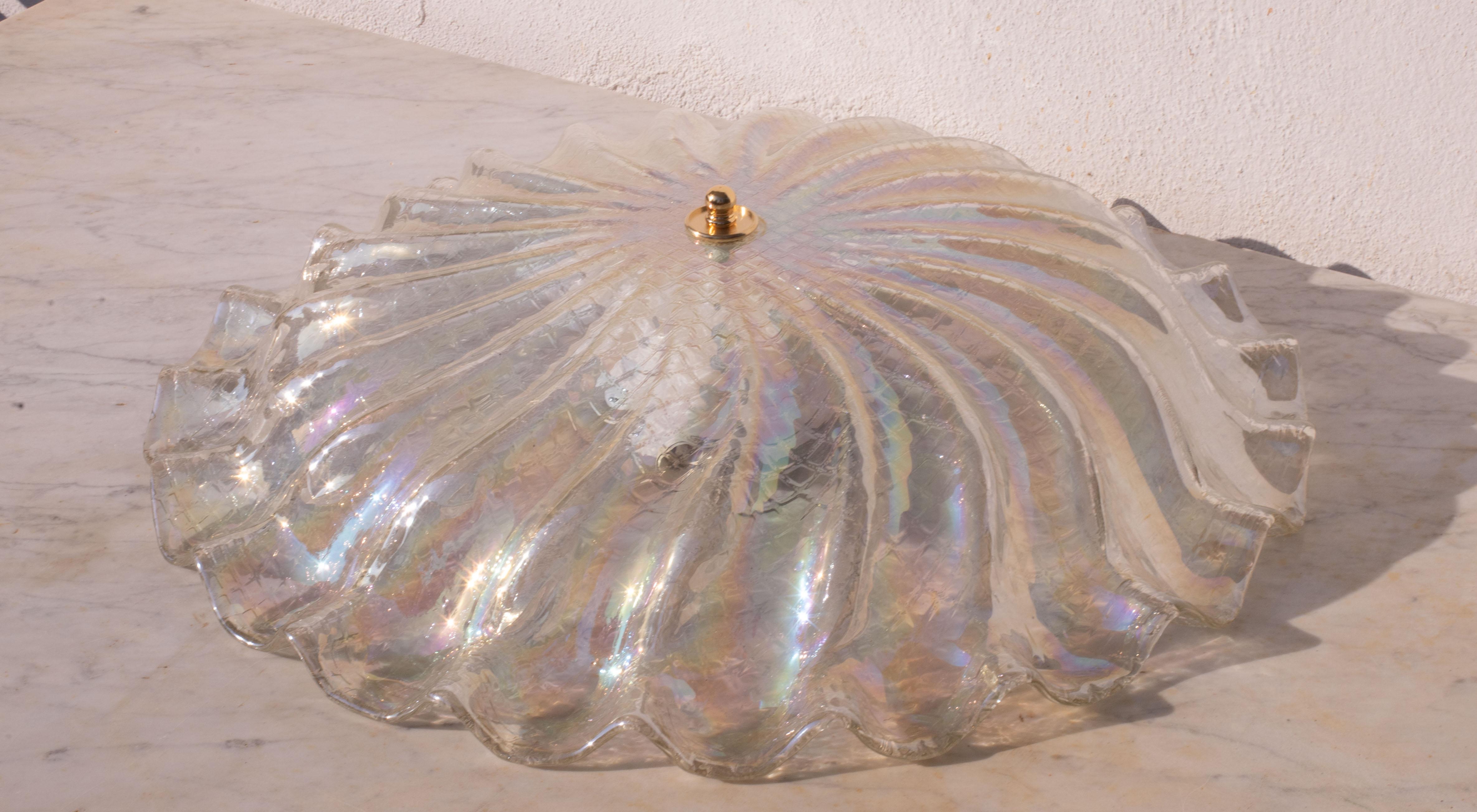 Stunning iridescent Murano ceiling light.
The special iridescent color makes the light shine with other colors when it is turned on
The ceiling light mounts tree lamp holders with E27 socket, but these can be changed on request fo Usa