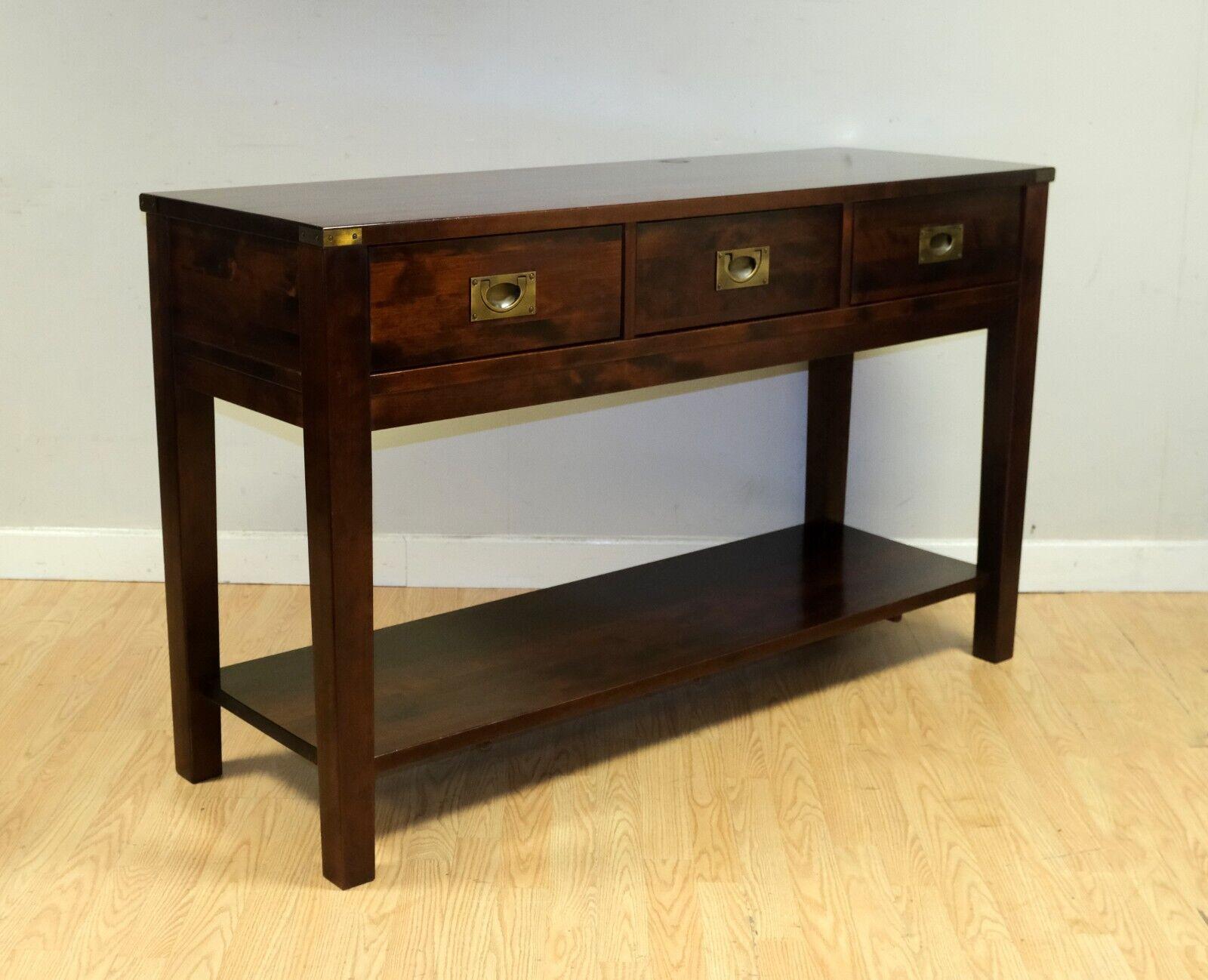 We are delighted to offer for sale this lovely Laura Ashley Chaldon range birch campaign style sideboard/console table. 

This piece draws inspiration from traditional period furniture with its campaign style and solid construction. It compromises