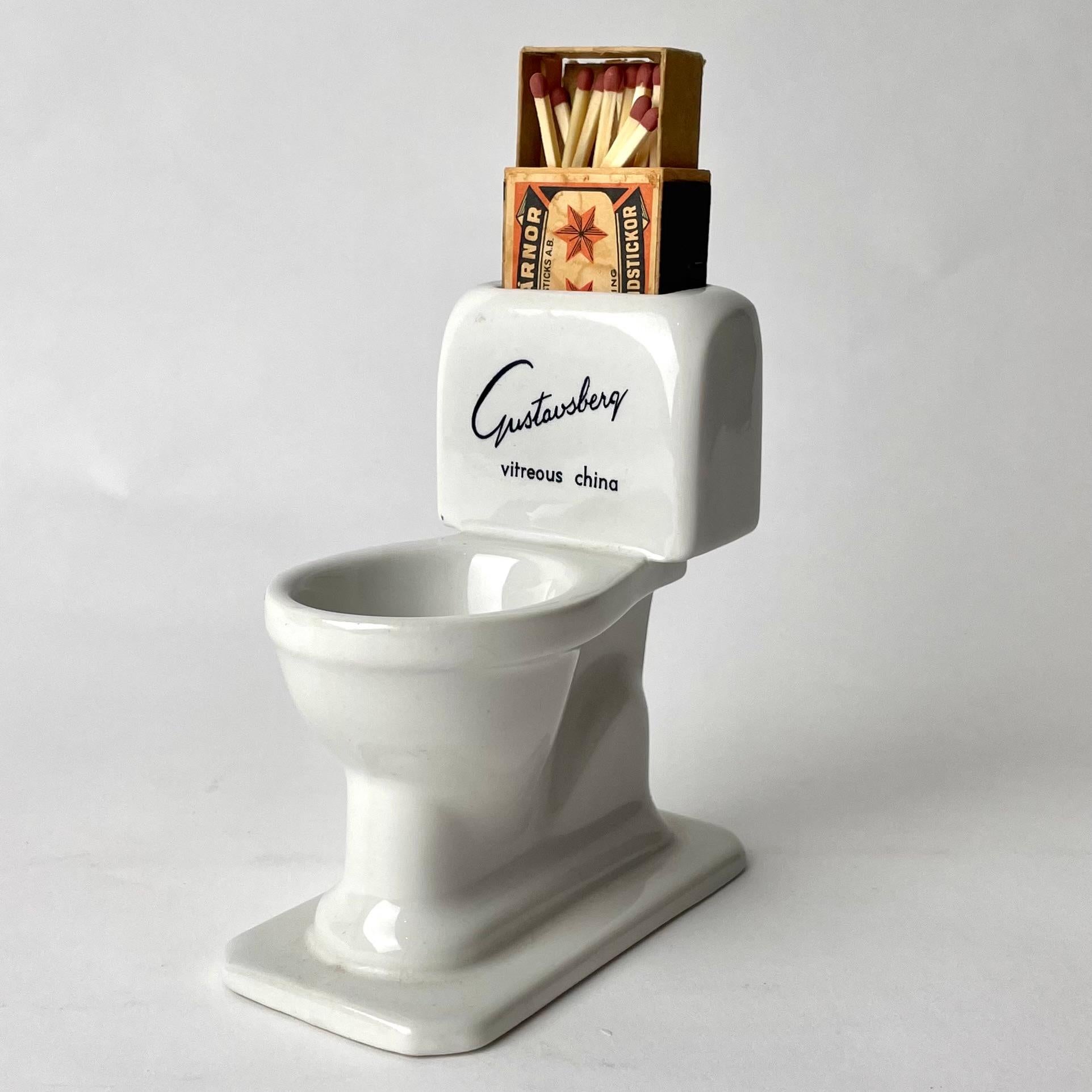 Very Charming and Fun Match Holder in the form of a toilet seat from mid-20th Century. Made by the famous porcelain manufacturer Gustavsberg, Sweden as a promotional gift for toilet seats

Wear consistent with age and use 