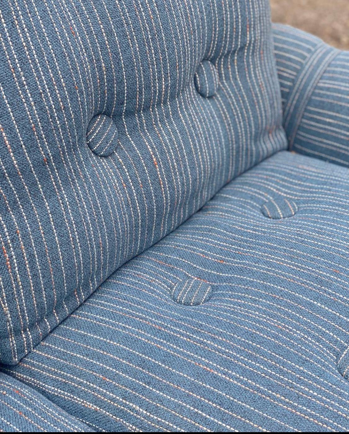 Charming MCM Teak Framed Love seat in the style of Jean Gillon for Probel -1960s

This sofa is THE love seat. 
Dressed in a blue speckled woven tweed and unique buckled arms, this piece is the perfect contemporary MCM piece for vintage lovers.