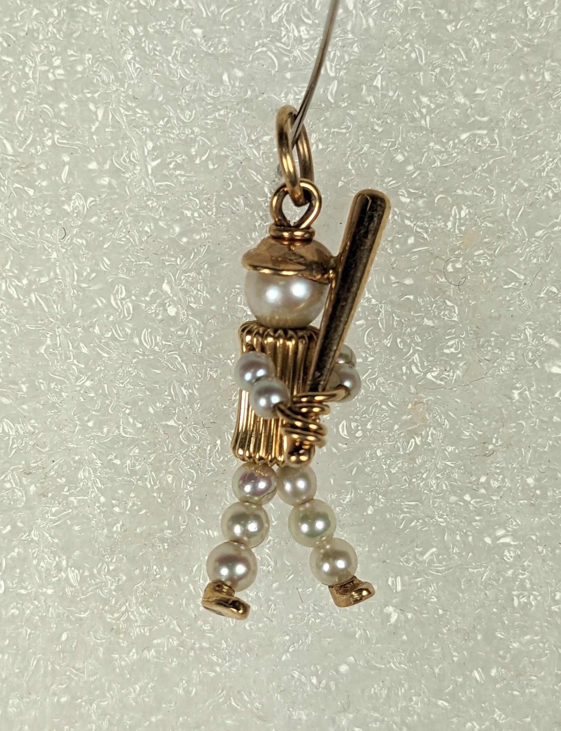 Charming Mid Century Gold and Pearl Baseball Charm of cast 14k gold elements and cultured pearls. Beautiful detailing and construction, 1950's USA. 1