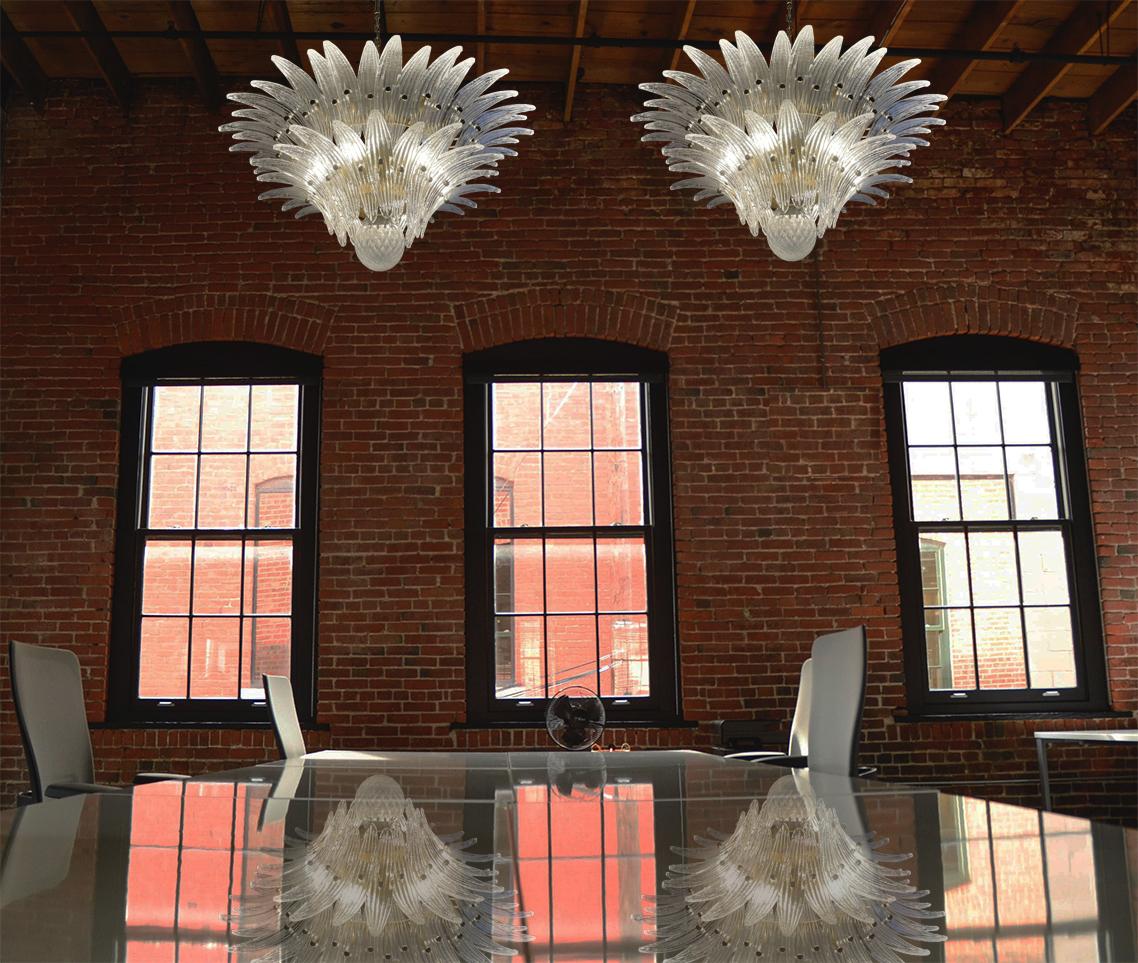 Luxury Trio Murano glass chandelier. Hand made in Murano. It made by 58 Murano crystal glasses in a gold metal frame. The chandelier has also a Murano glass ball in the end of the lamp. Murano blown glass in a traditional way.
Period: 1970s /
