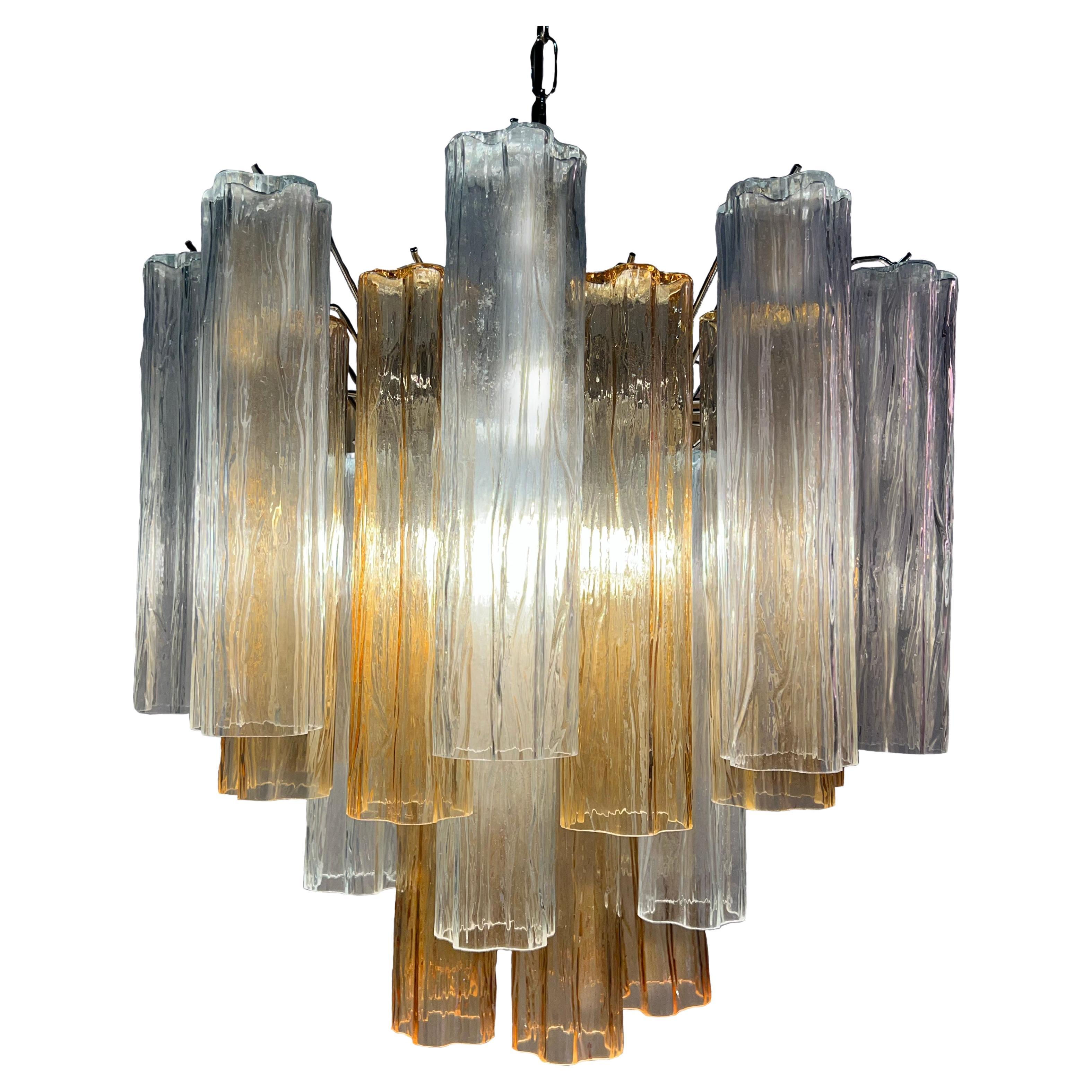 Fascinating Murano chandeliers. It is composed of 30 star-shaped panes of pure Murano glass. The height is adjustable according to the height of the ceiling. At no extra cost we will replace the original lamp holders with those in use in the USA.