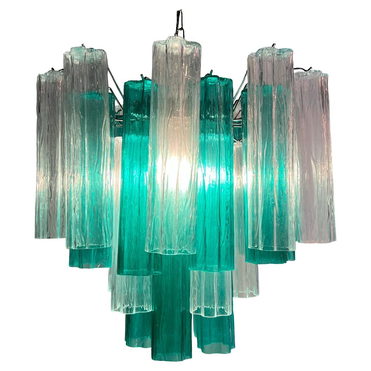 Fascinating Murano chandeliers. It is composed of 30 star shaped panes of pure Murano glass. The height is adjustable according to the height of the ceiling. At no extra cost we will replace the original lamp holders with those in use in the USA.