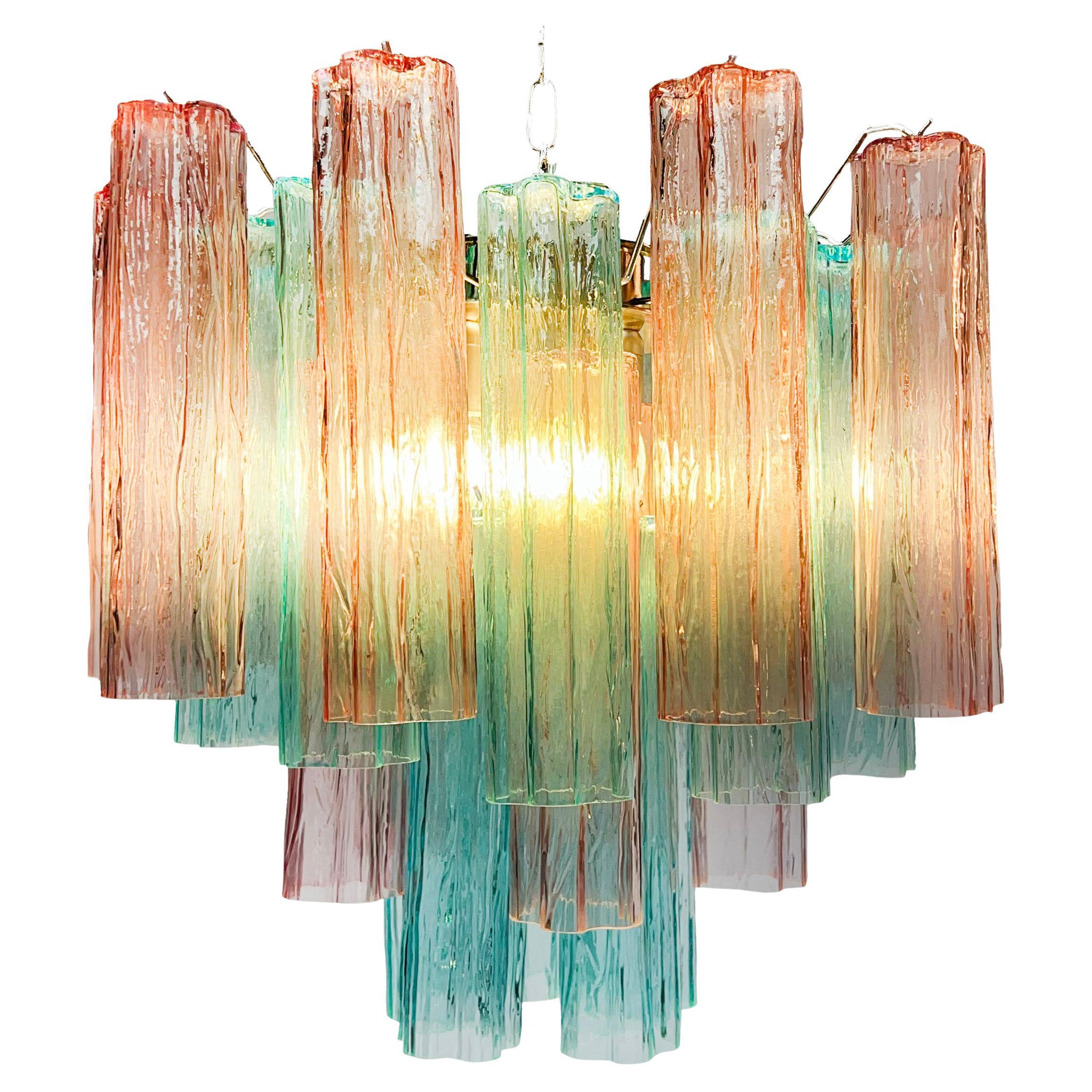 Fascinating Murano chandeliers. It is composed of 30 star-shaped panes of pure Murano glass. The height is adjustable according to the height of the ceiling. At no extra cost we will replace the original lamp holders with those in use in the USA.
