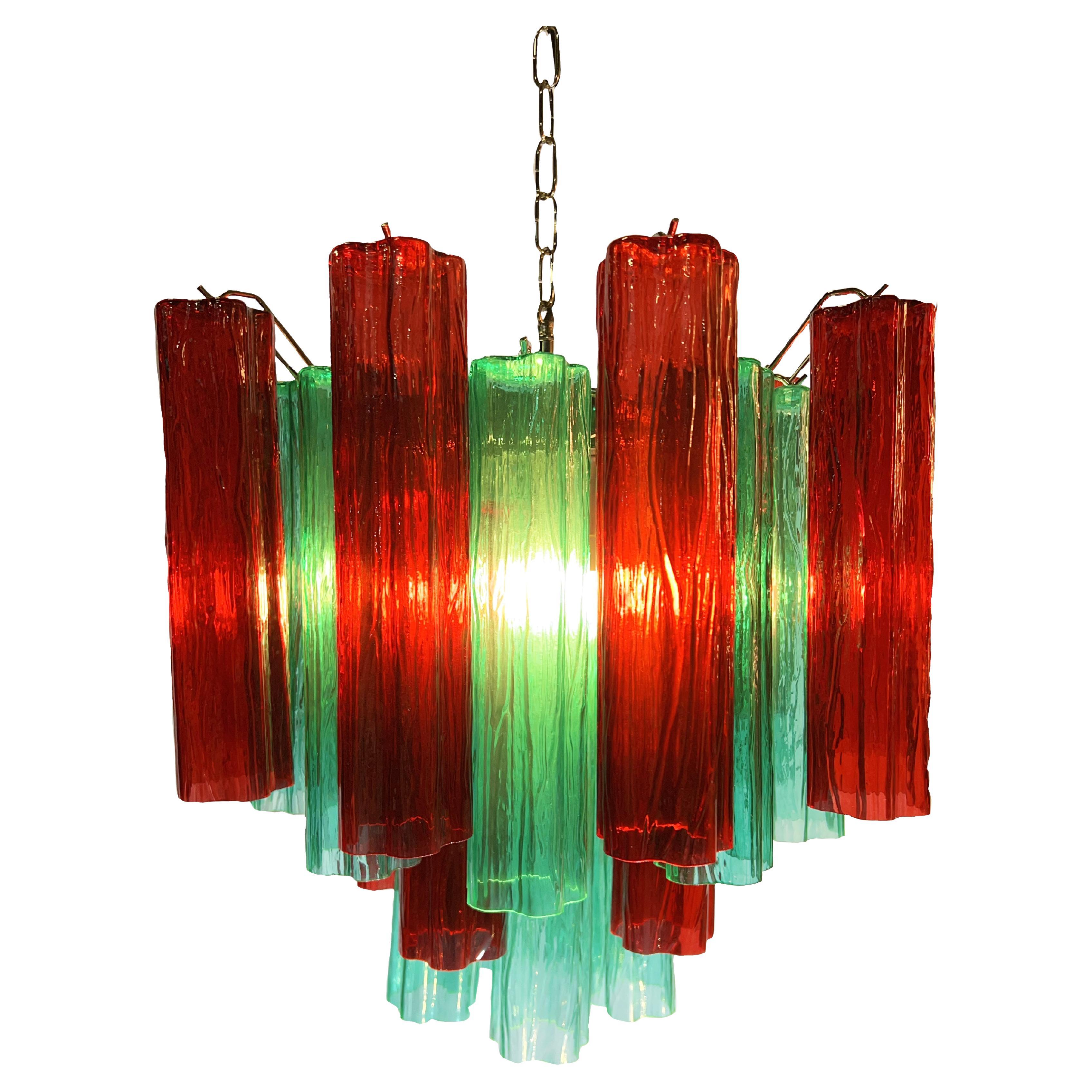 Fascinating Murano chandeliers. It is composed of 30 star shaped panes of pure Murano glass. The height is adjustable according to the height of the ceiling. At no extra cost we will replace the original lamp holders with those in use in the USA.