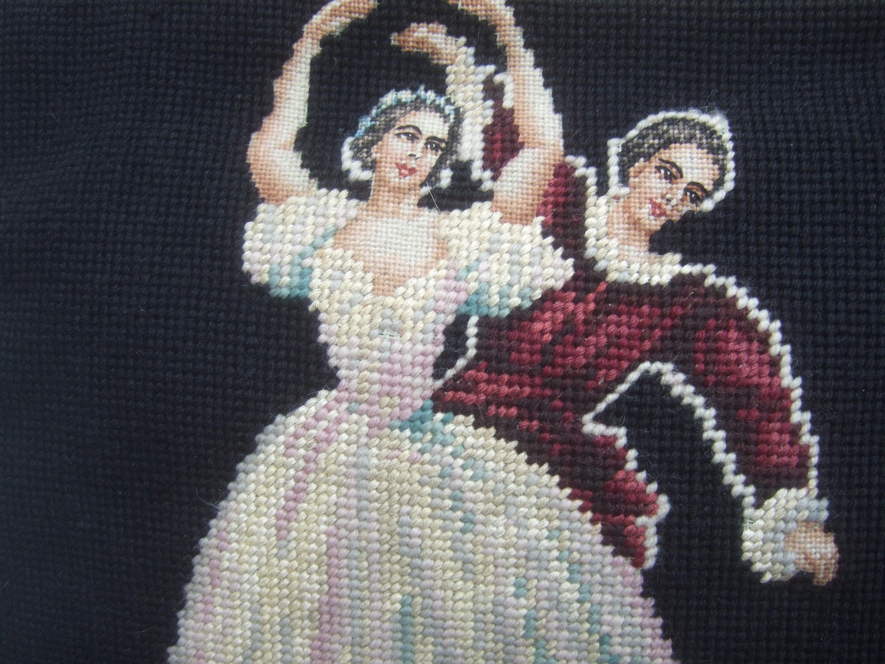 Charming needlepoint ballet scene artisan handbag c 1960
The unique artisan handbag is designed with two different ballet
scenes on both exterior sides. Illuminated against a black needlepoint 
background

Carried with a gilt metal chain strap lined