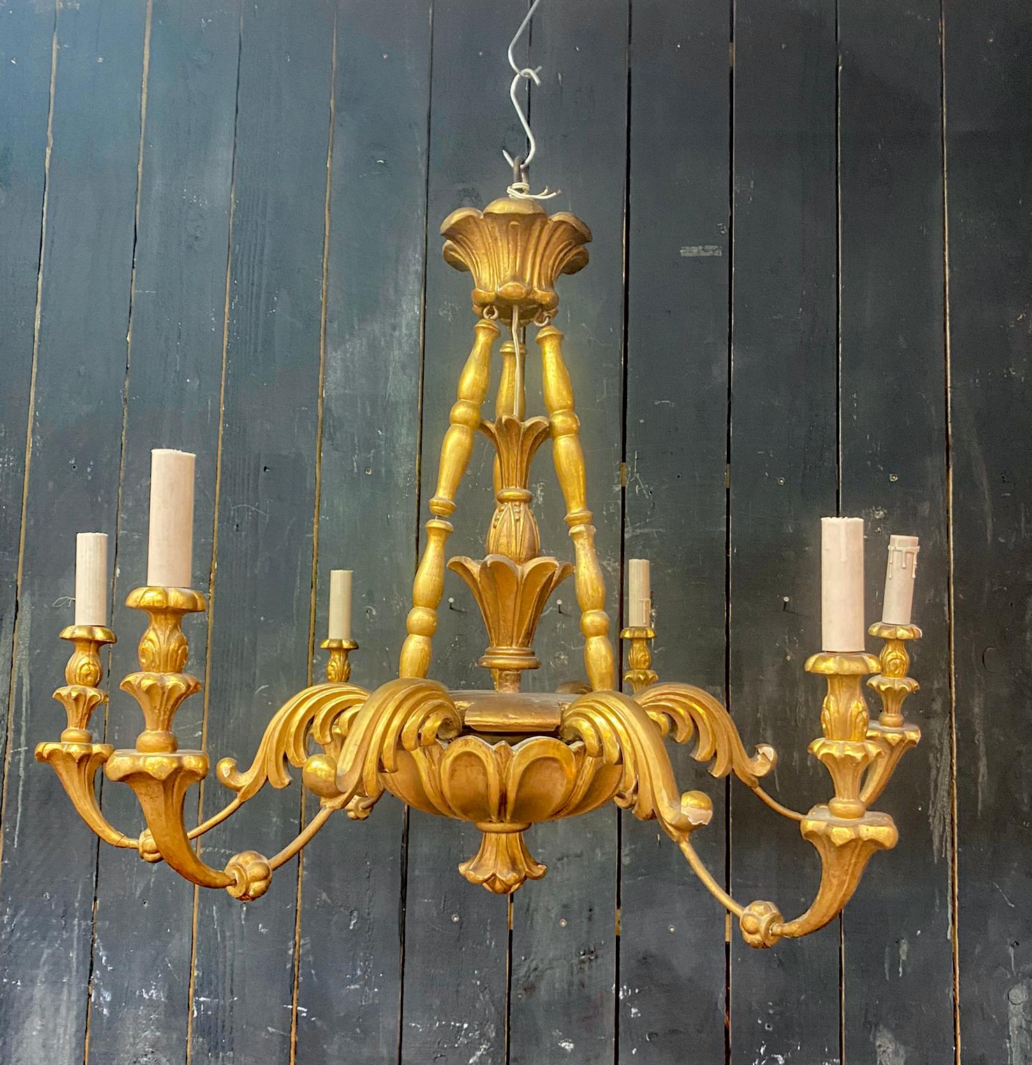 Charming  Neo baroque Chandelier in giltwood circa 1950
some lack of gilding and wear, but the general condition remains very satisfactory