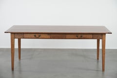 Charming old French dining table made of cherry wood with two drawers