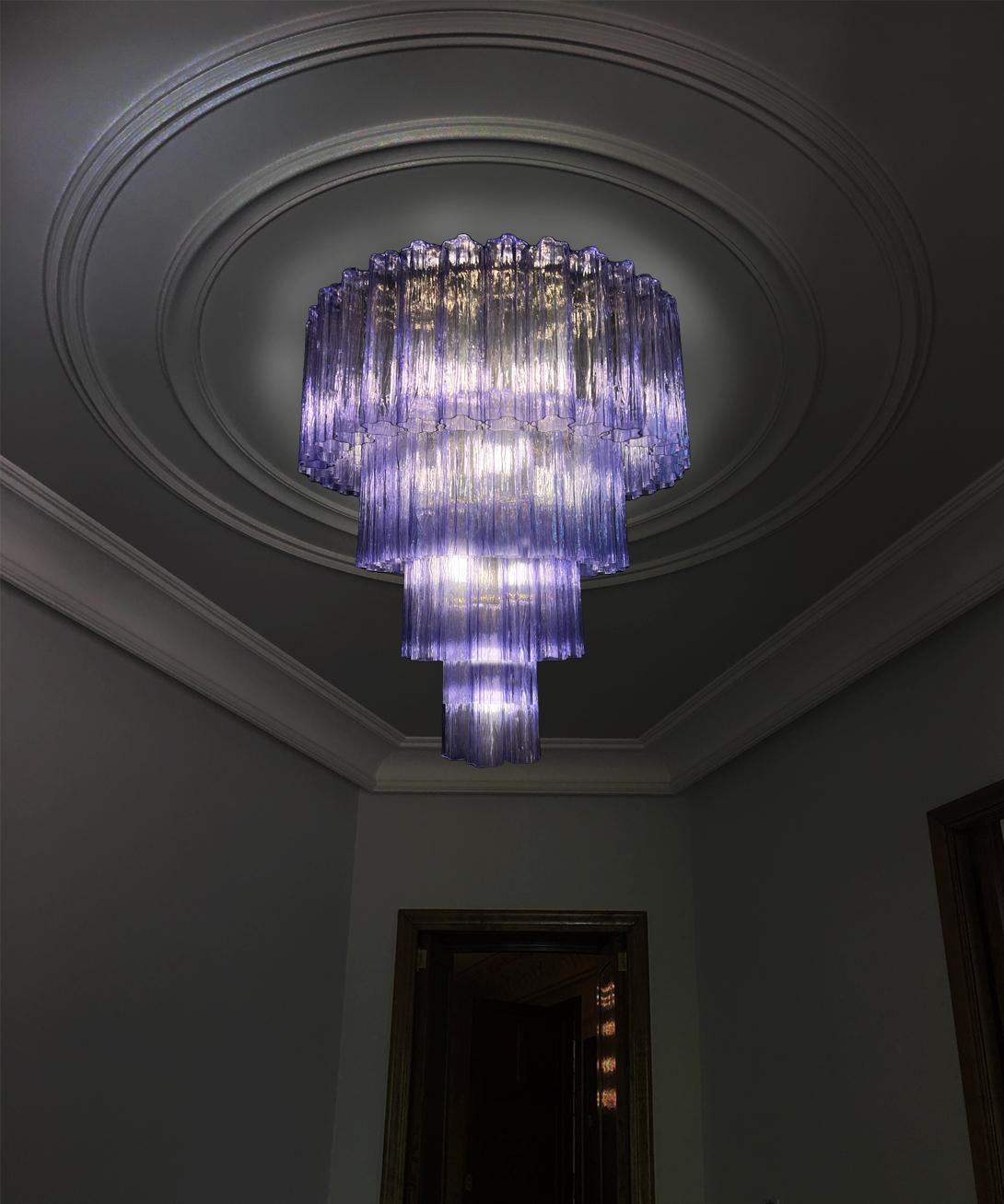 Stunning Pair Murano chandeliers. The sophisticated amethyst elegantly reflects the light harmoniously. The height without chain is 112 cm. It can be made to the dimensions requested by the customer.