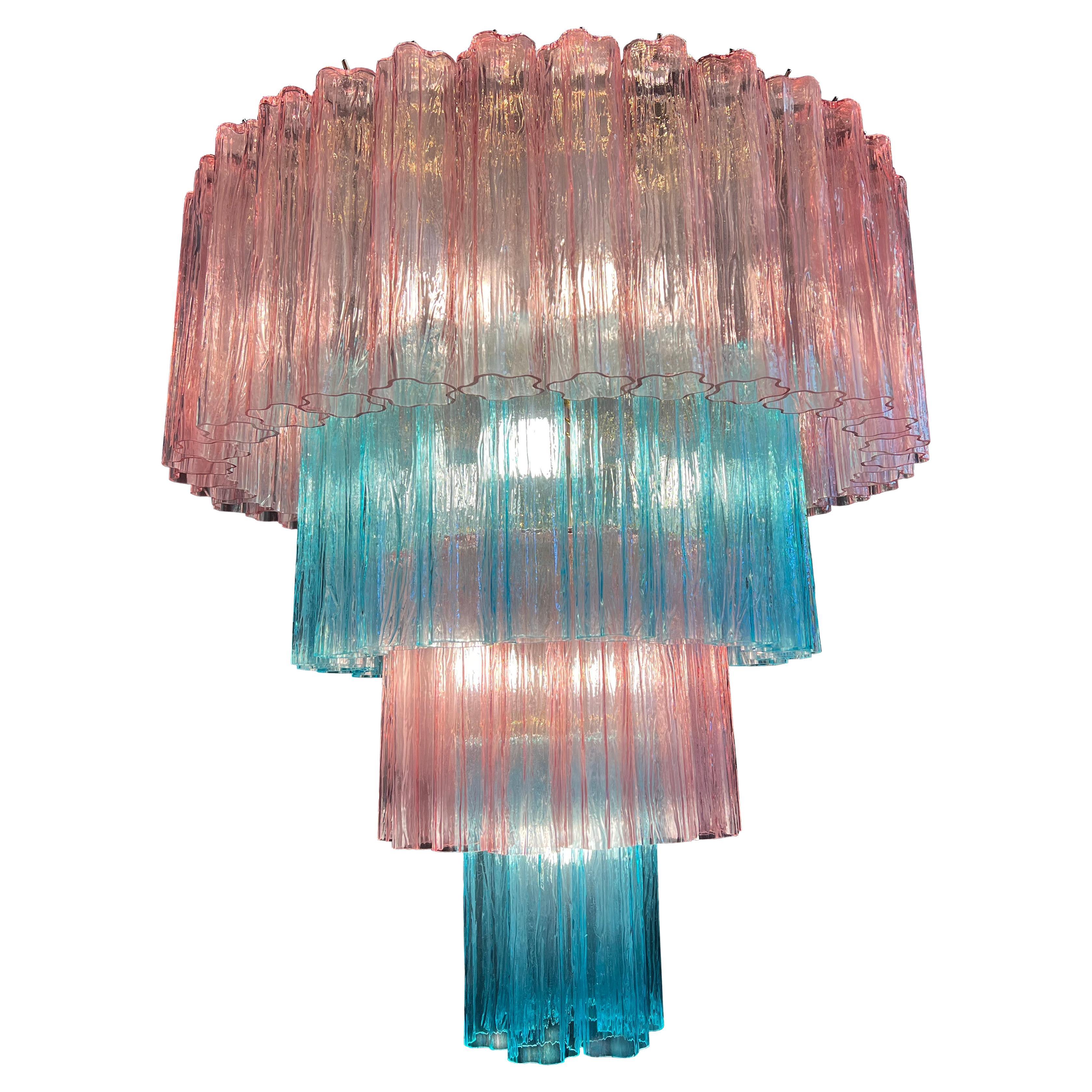 Stunning Pair Murano chandeliers. The sophisticated pink and blue color elegantly reflects the light. The height without chain is 112 cm. It can be made to the dimensions requested by the customer.