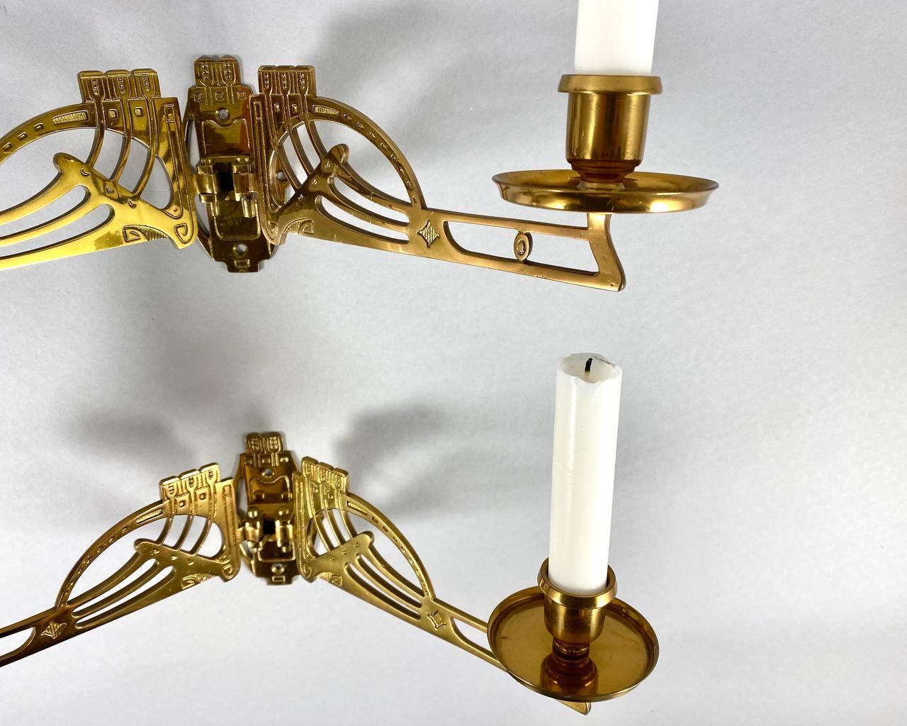 Beautiful twin pair of Art Nouveau piano candlesticks.

Both made in gilt brass, complete, with no losses, full Art Nouveau period, with the arms.

The arms of the candle holders are pivotable.

 A stylish wall candleholders will easily add a