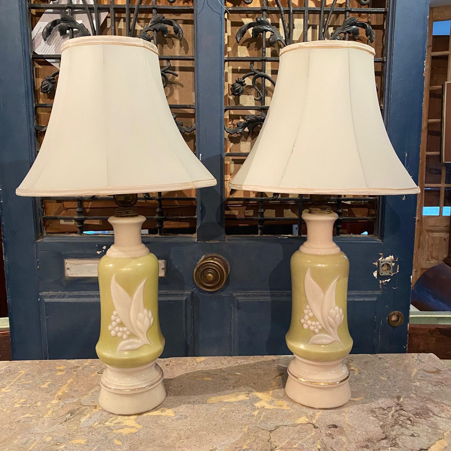 Wonderful pair of lime green vintage molded glass table lamps with original shades.
