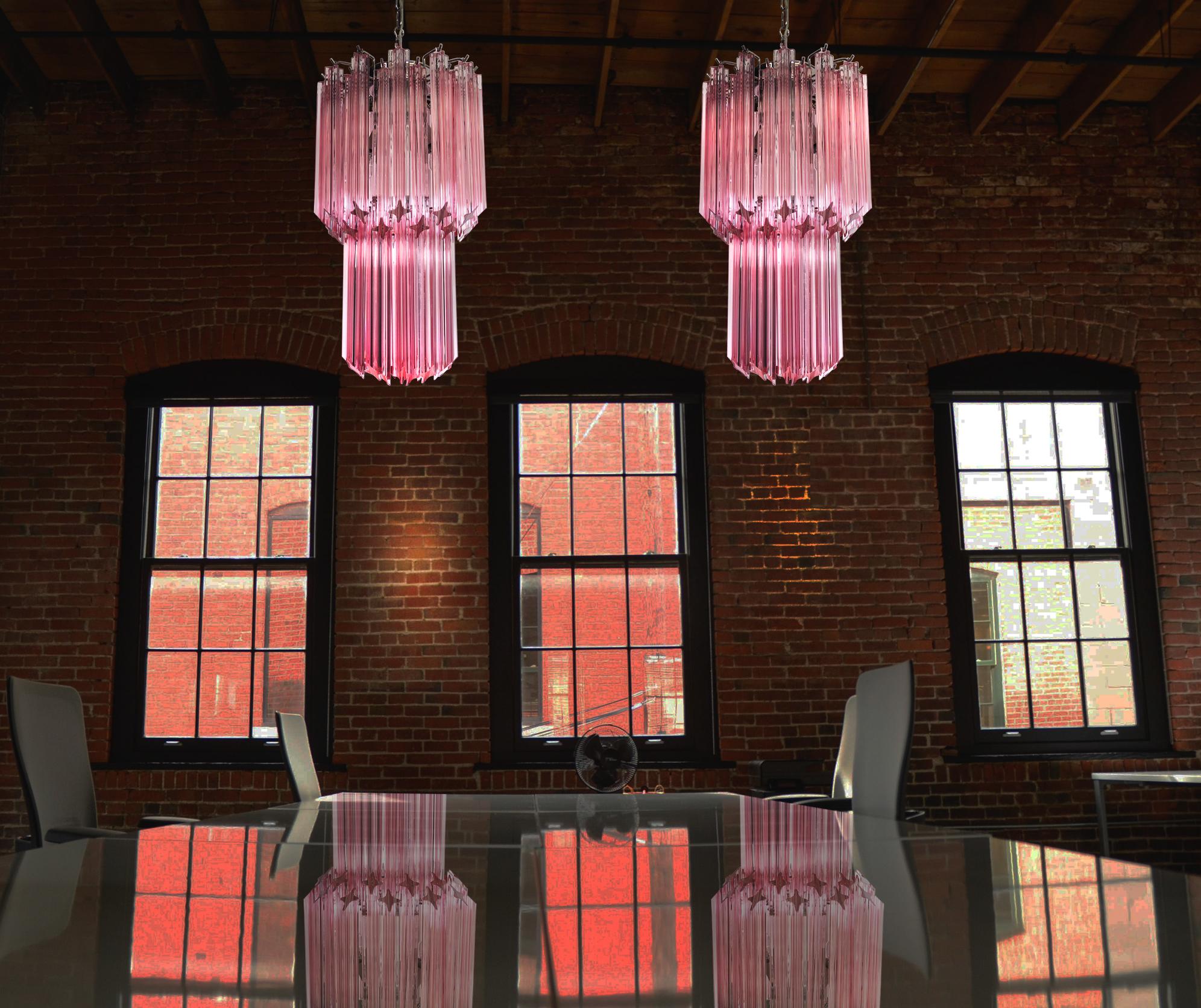 Pair of fantastic vintage Murano chandeliers made by 46 Murano crystal pink prism in a nickel metal frame.
Period: late 20th century
Dimensions: 55.10 inches height (140 cm) with chain; 27.50 inches height (70 cm) without chain; 12.6 inches diameter