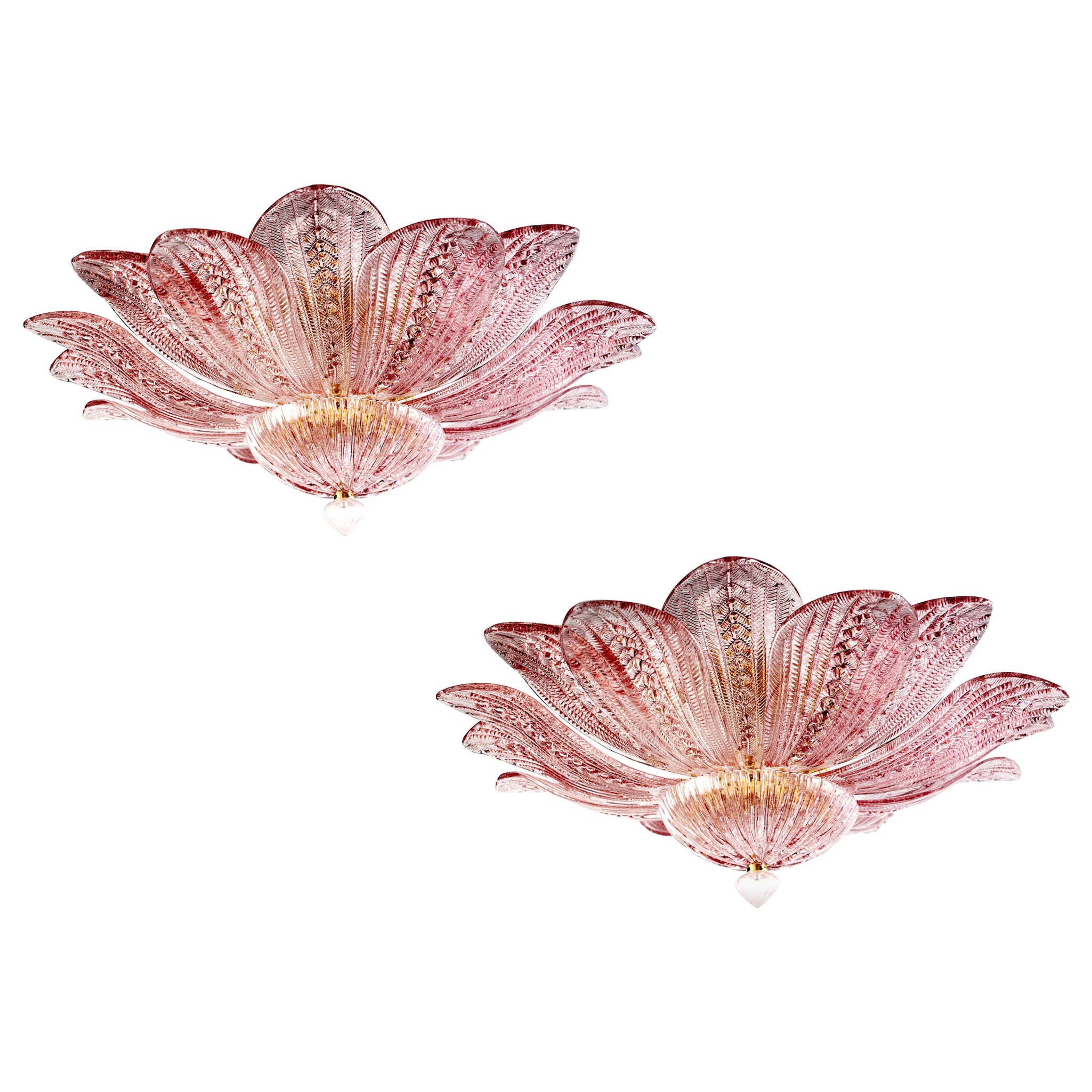 Realized in pure pink amethyst color Murano glass consists of 16 delicious hand blown leaves.
 The structure is gilt-metal. Five E27 lights spread a magical light.
Available 3 items.
This light fixture can be disassembled and the leaves individually