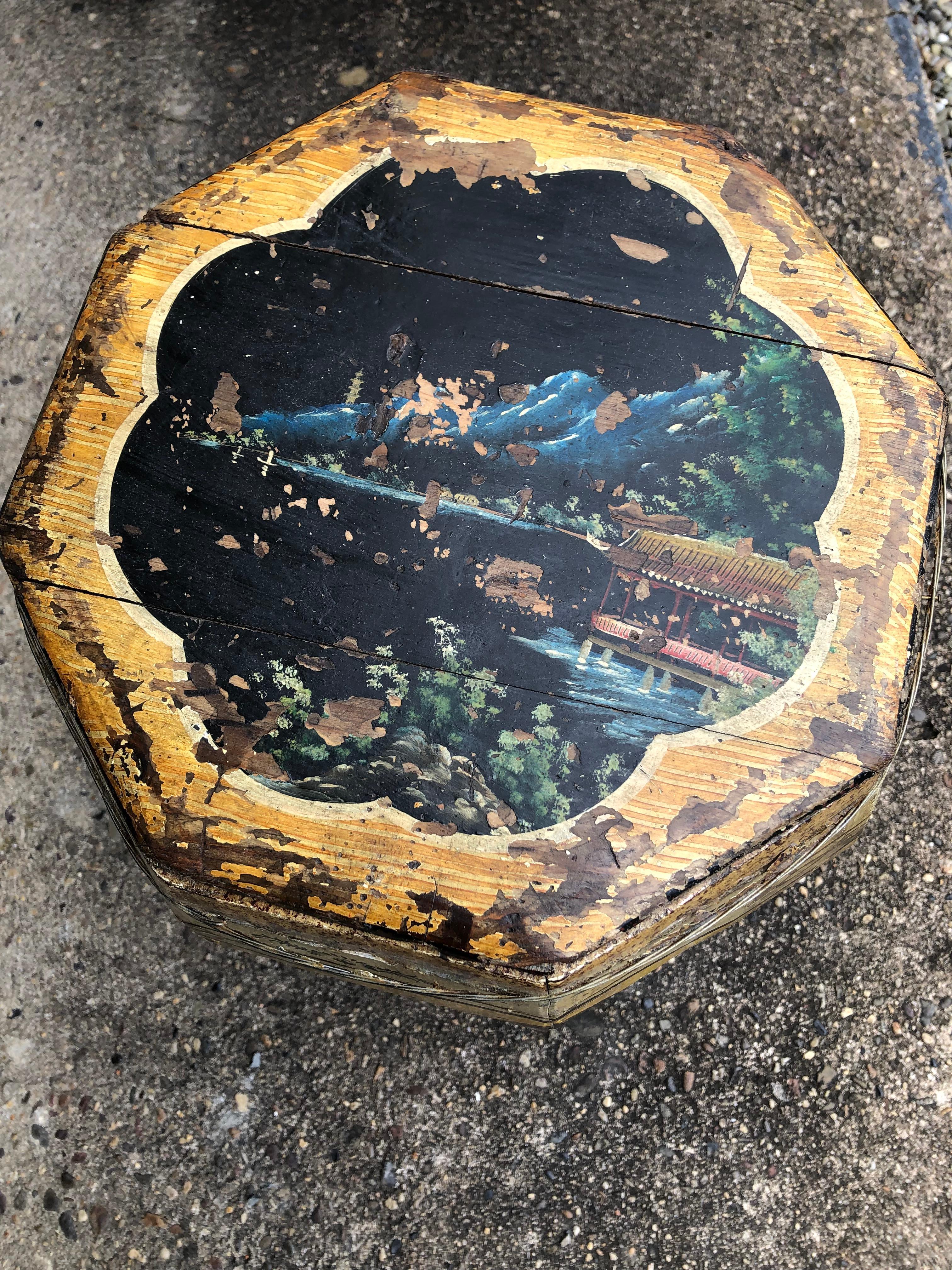 Charming and one of a kind hand painted antique wooden rice bin that makes a wonderful end table. The rustic piece has lovely folk art primitive paintings of swans, birds, and foliage with a yellow and black background. Top comes off and the