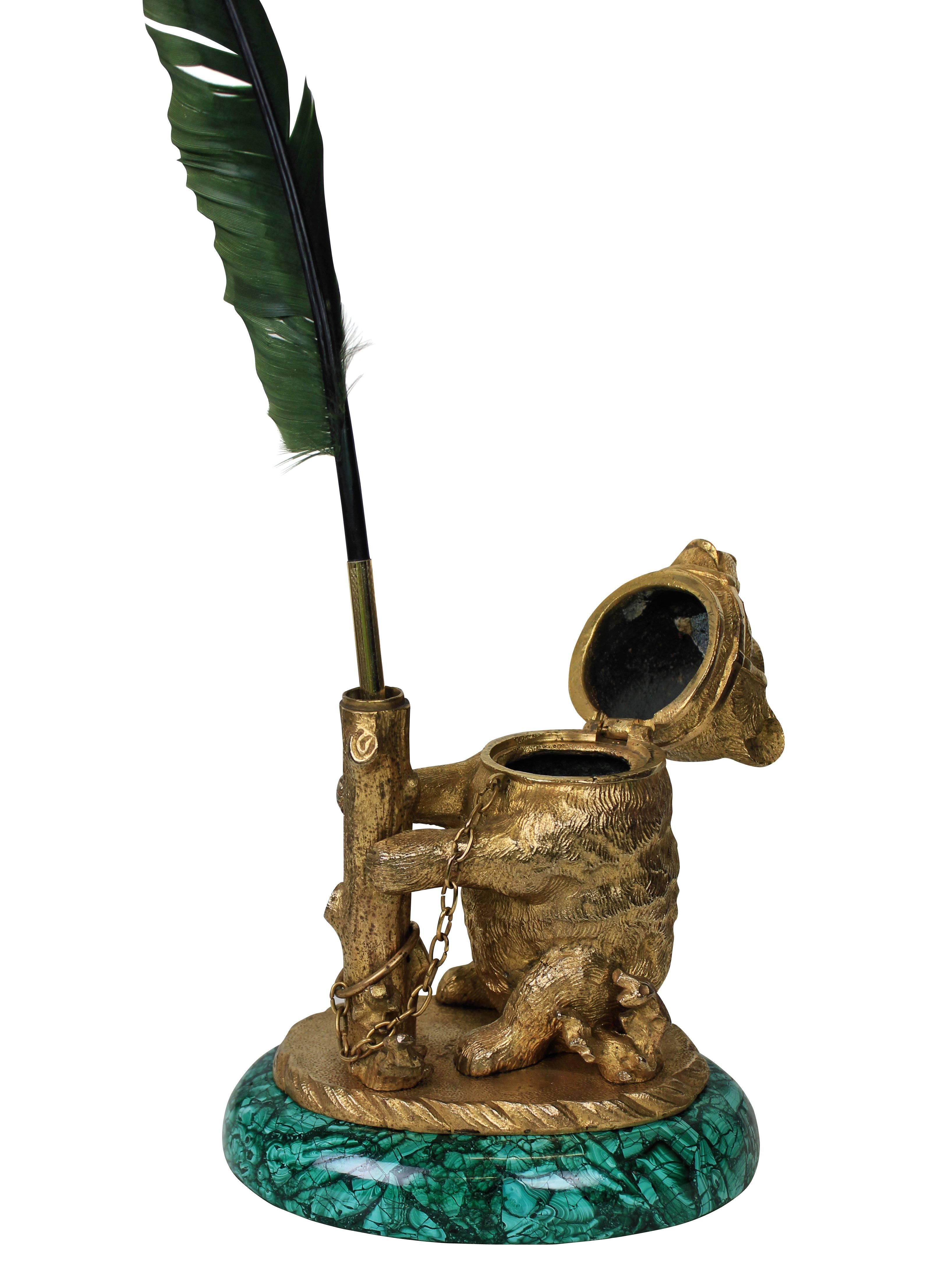 A fine Russian encrier (ink pot) in the form of a bear in ormolu with ruby eyes and on a malachite base.