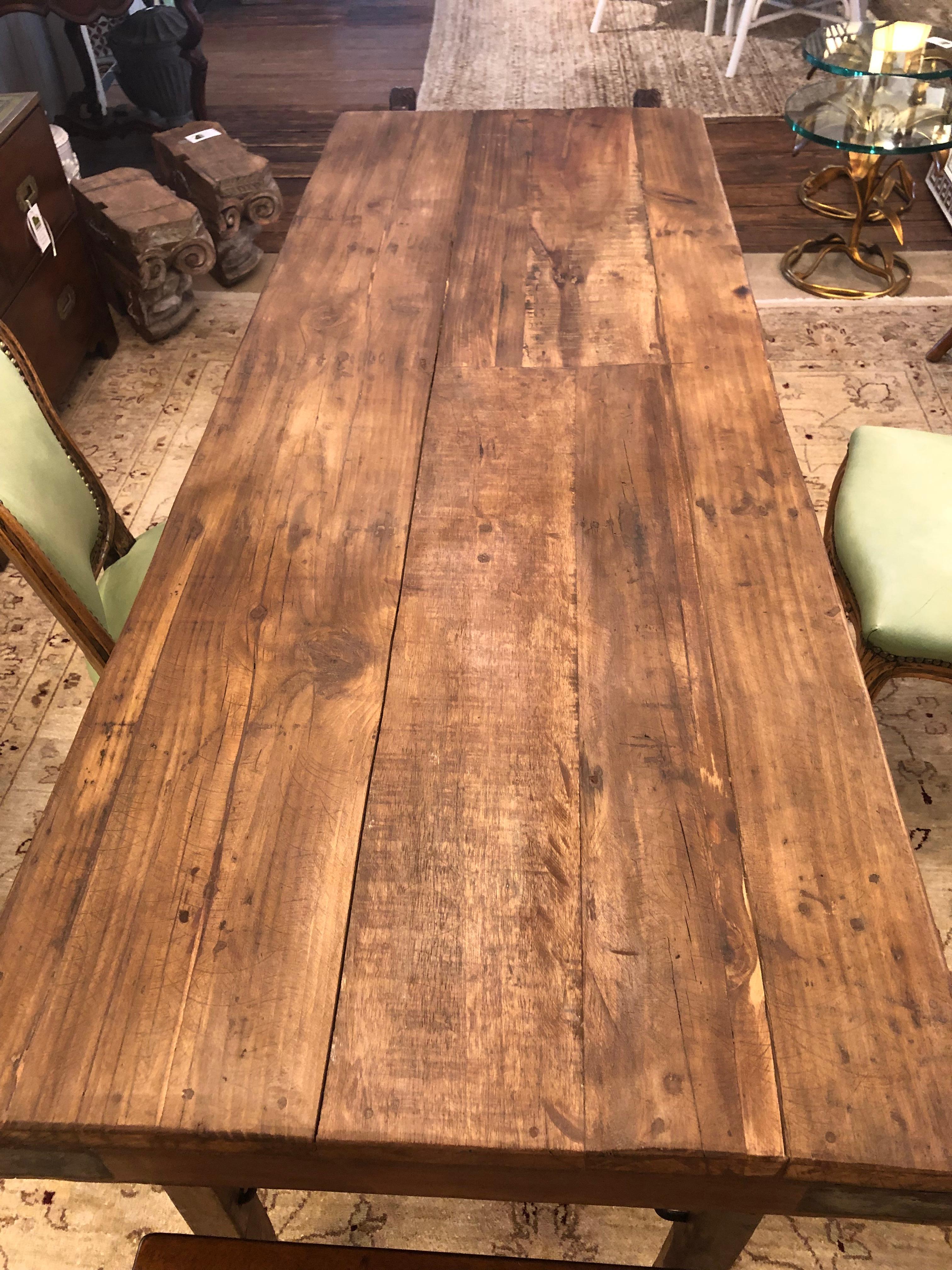 Charming versatile vintage pine tavern table having plank top, iron reinforced corners, and collapsible legs. Could be used as a narrow dining table , console or work table.
Apron 26.75 h.