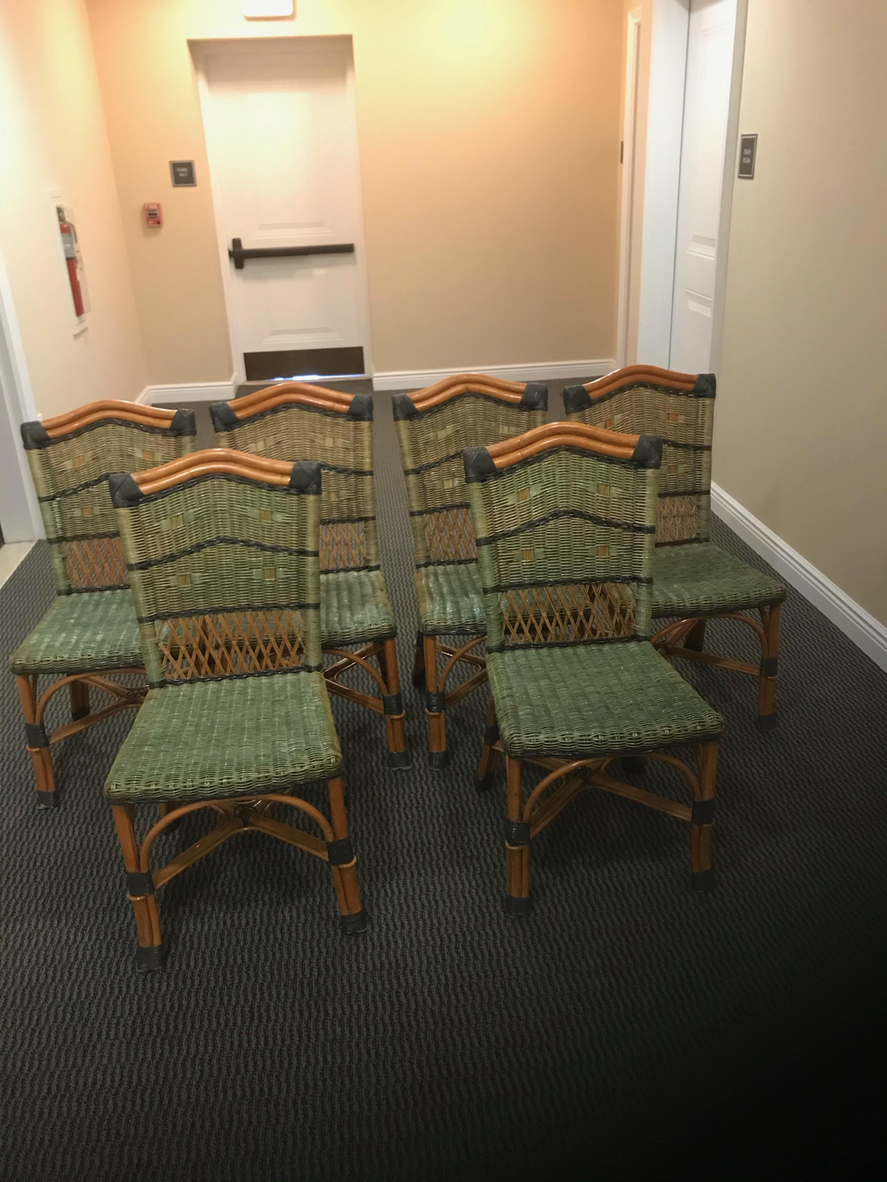 A stunning set of 6 Grange rattan side chairs from the 1970s having an inviting color combination of natural honey colored wood with dark and light green on seats. The coiled rattan on legs is dark green. Comes with 6 custom cushions.


 