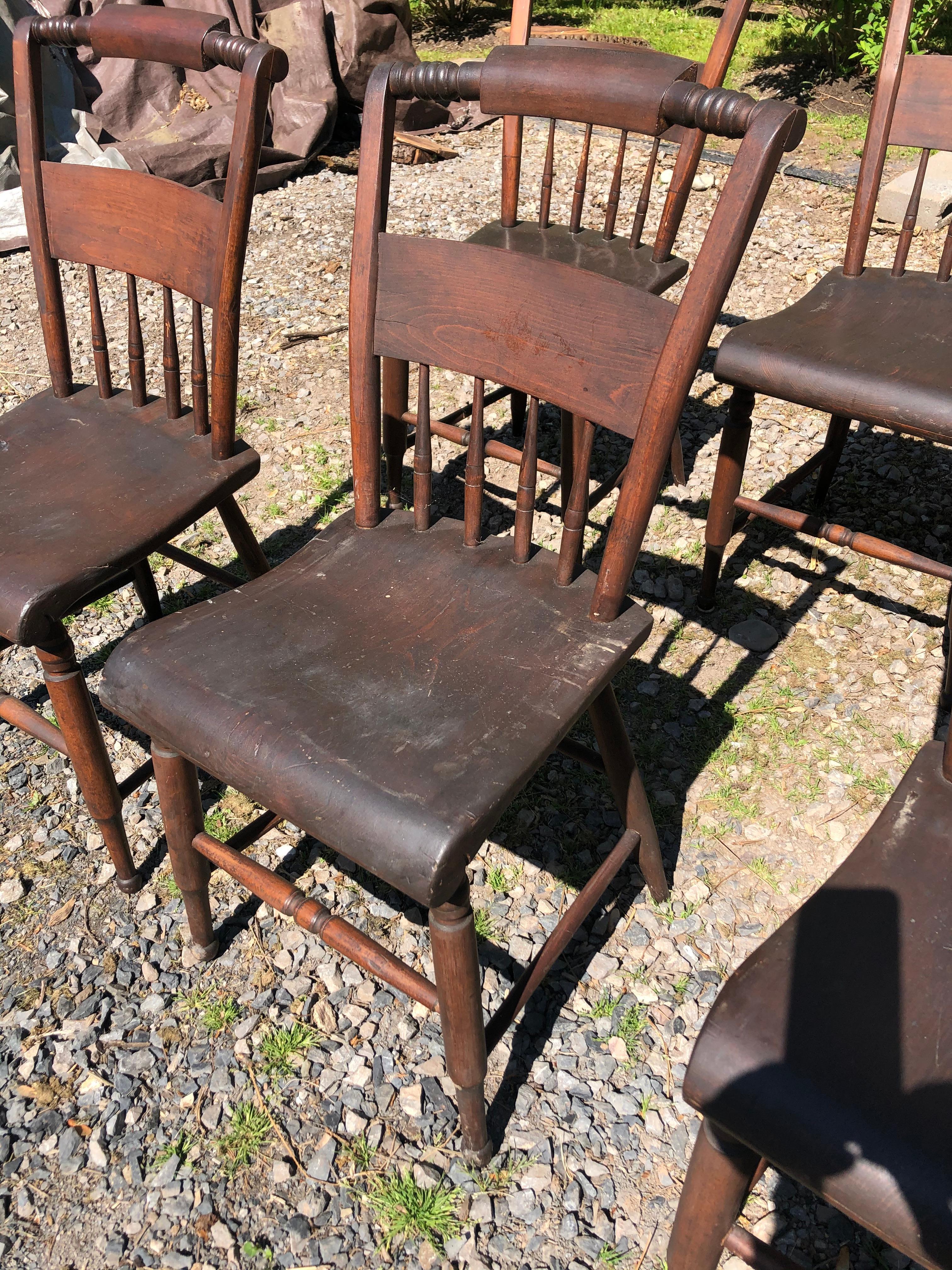 A charming set of 8 farmhouse style spindle back dining chairs having turned legs and molded seats.
The chairs are sturdy but much loved. Could use a spit and polish, but they are priced as is.
Note: There's a versatile drop leaf dining table to