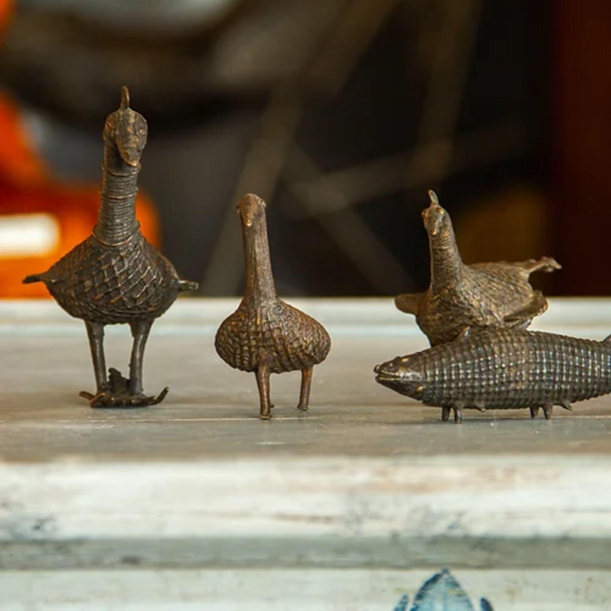 Charming set of four small simply carved bronze animals comprising of two peacocks, llama and a fish.

Additional Information:
Material: Bronze, Glass
Dimensions: 12 D x 7 W x 12 H cm