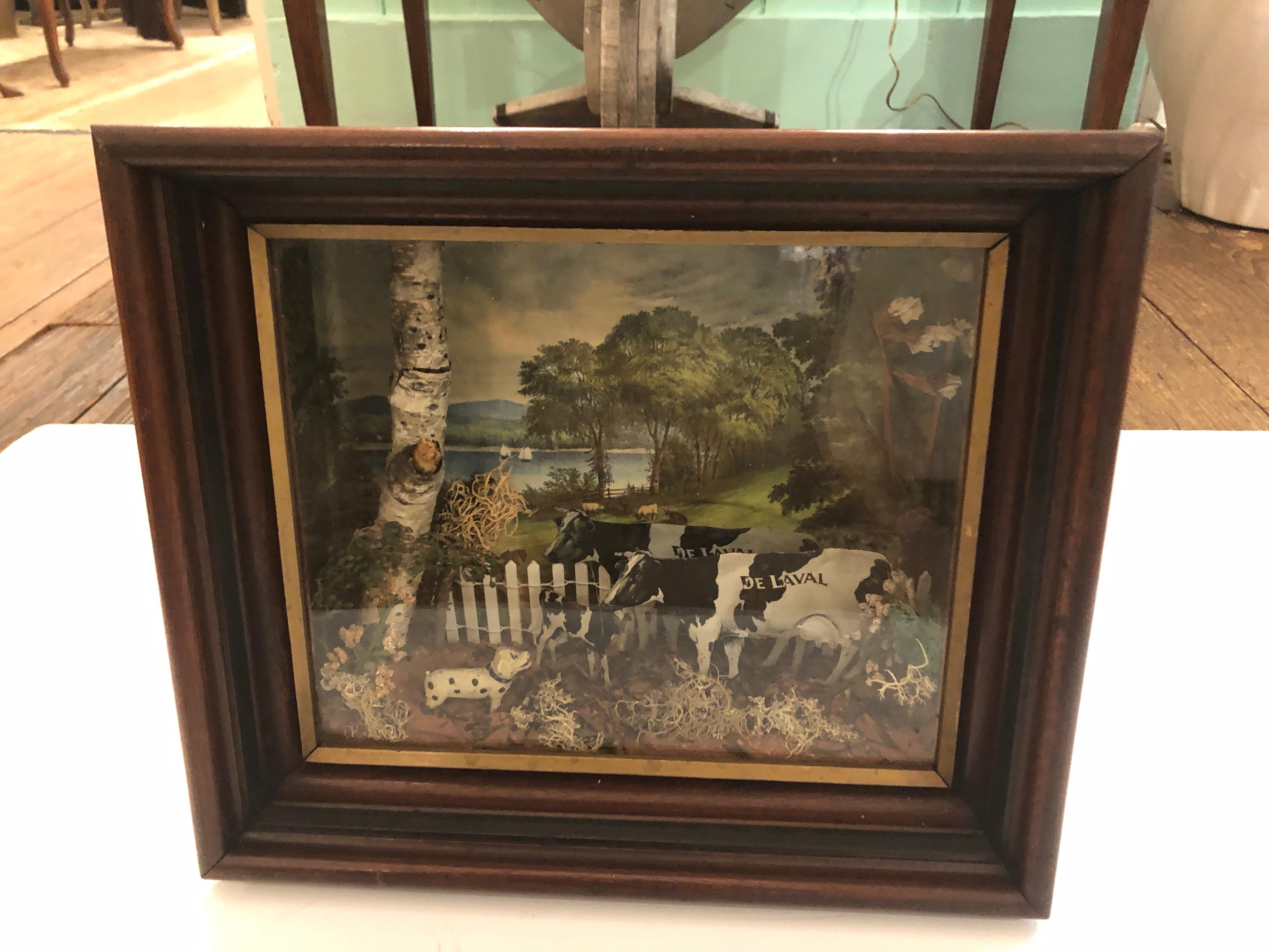 Charming very dailed diorama in a mahogany and glass shadowbox having adorable pastural scene with cows, dog, and farm country scene.