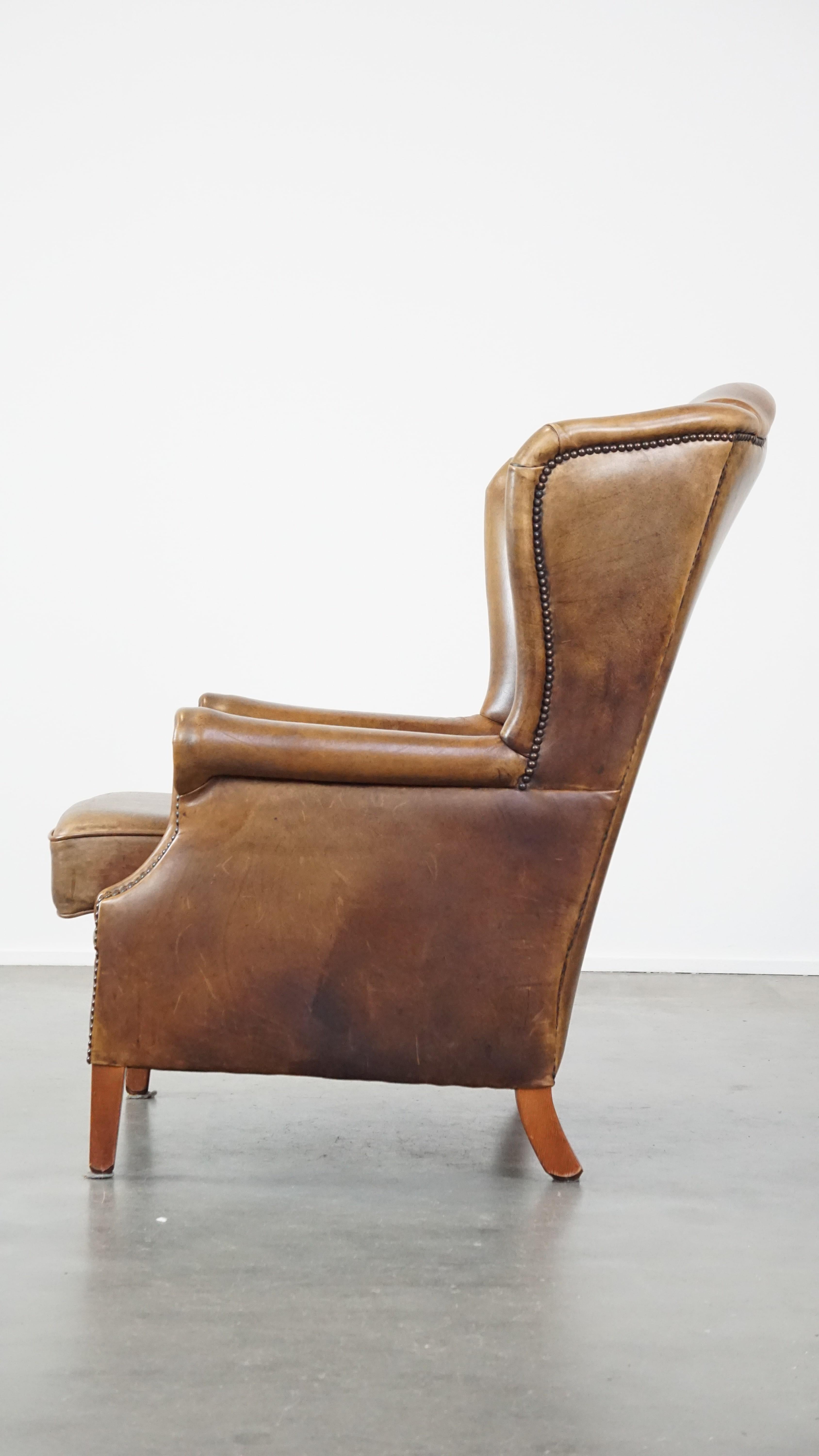 Cuir Charmant fauteuil à dossier en cuir de mouton avec un excellent confort d'assise en vente