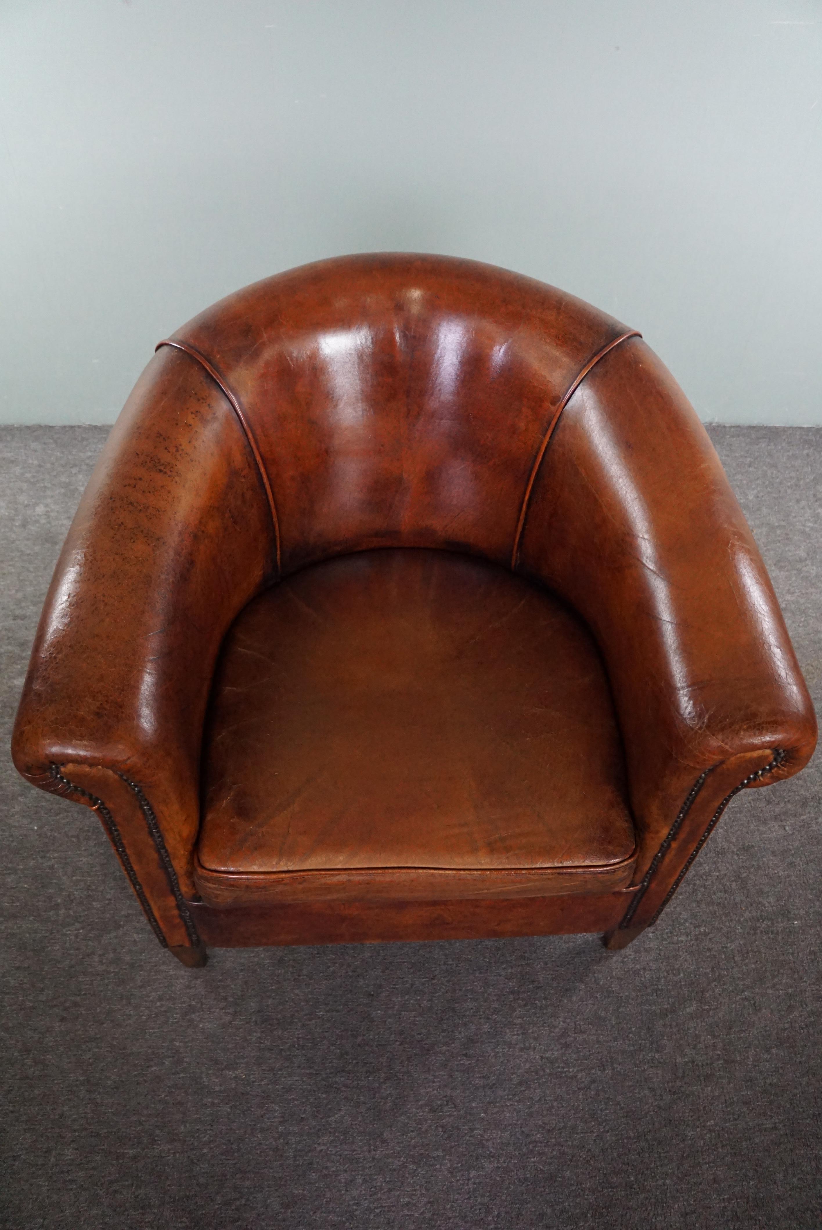 Leather Charming sheepskin club chair. For Sale