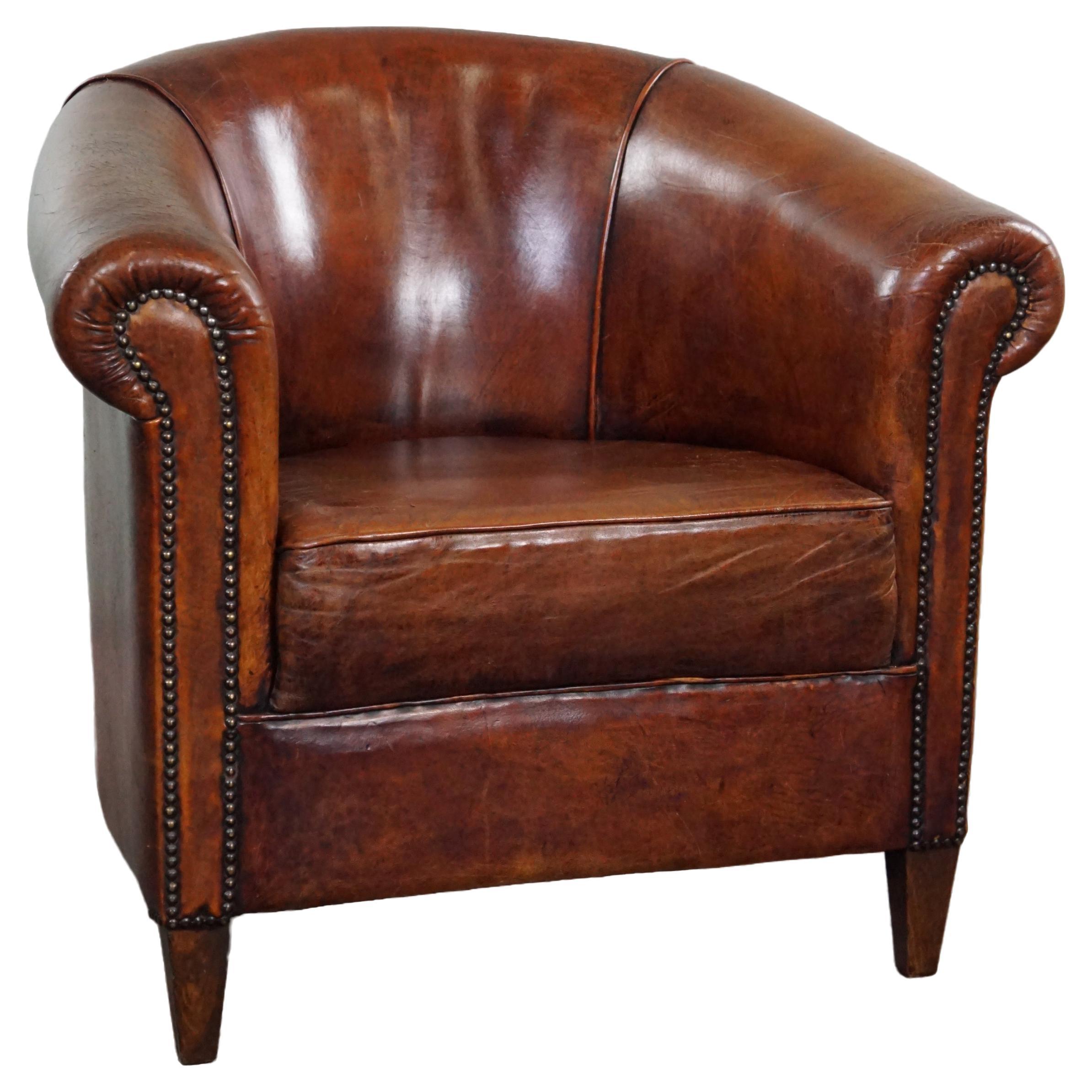 Charming sheepskin club chair. For Sale