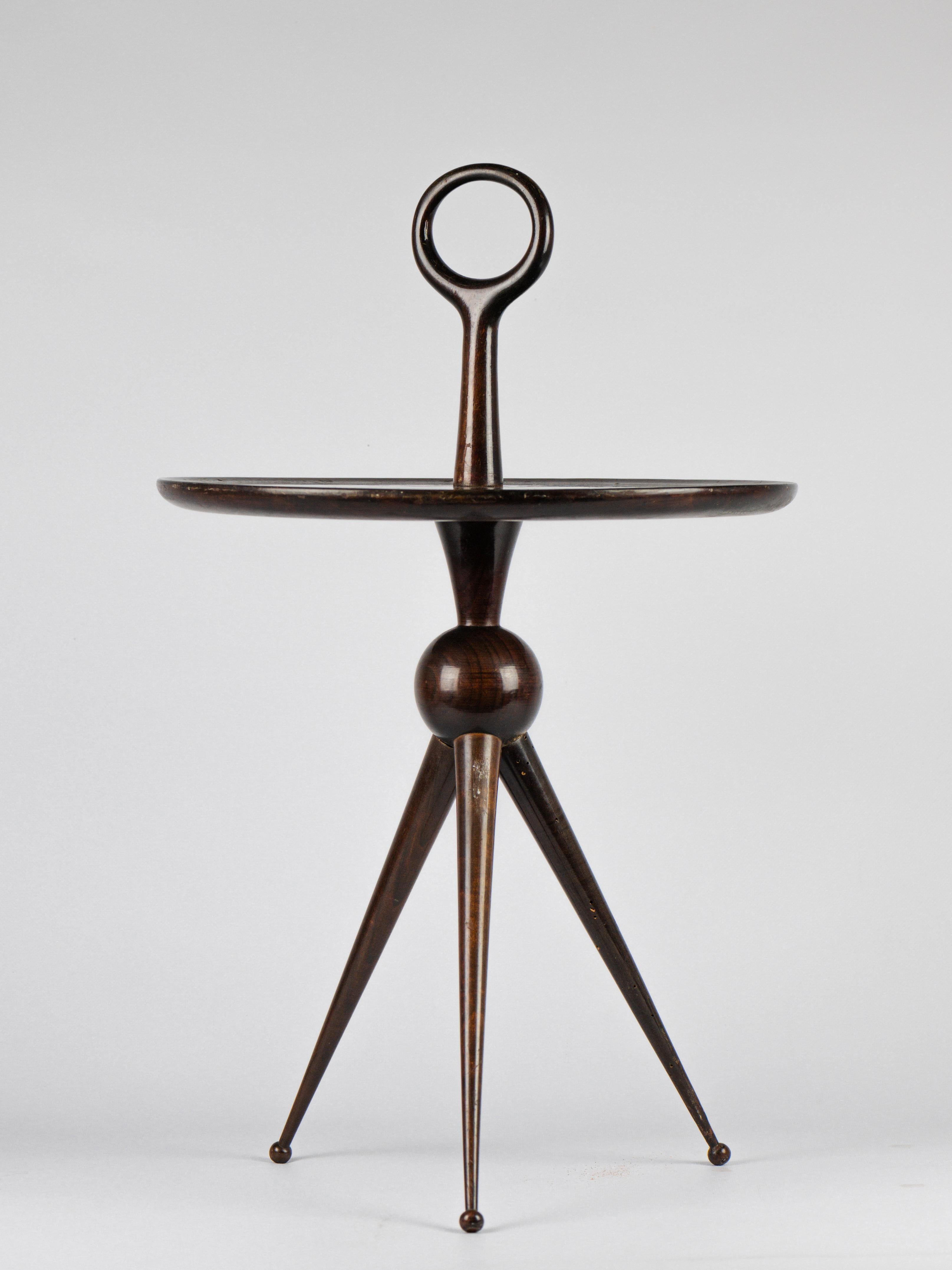 Very elegant side / serving table. 

Italian work from De Baggis edition. 

Dark wood like Walnut. 

3 feet, 1 handle. Very light. 

Good condition, small insect holes. 