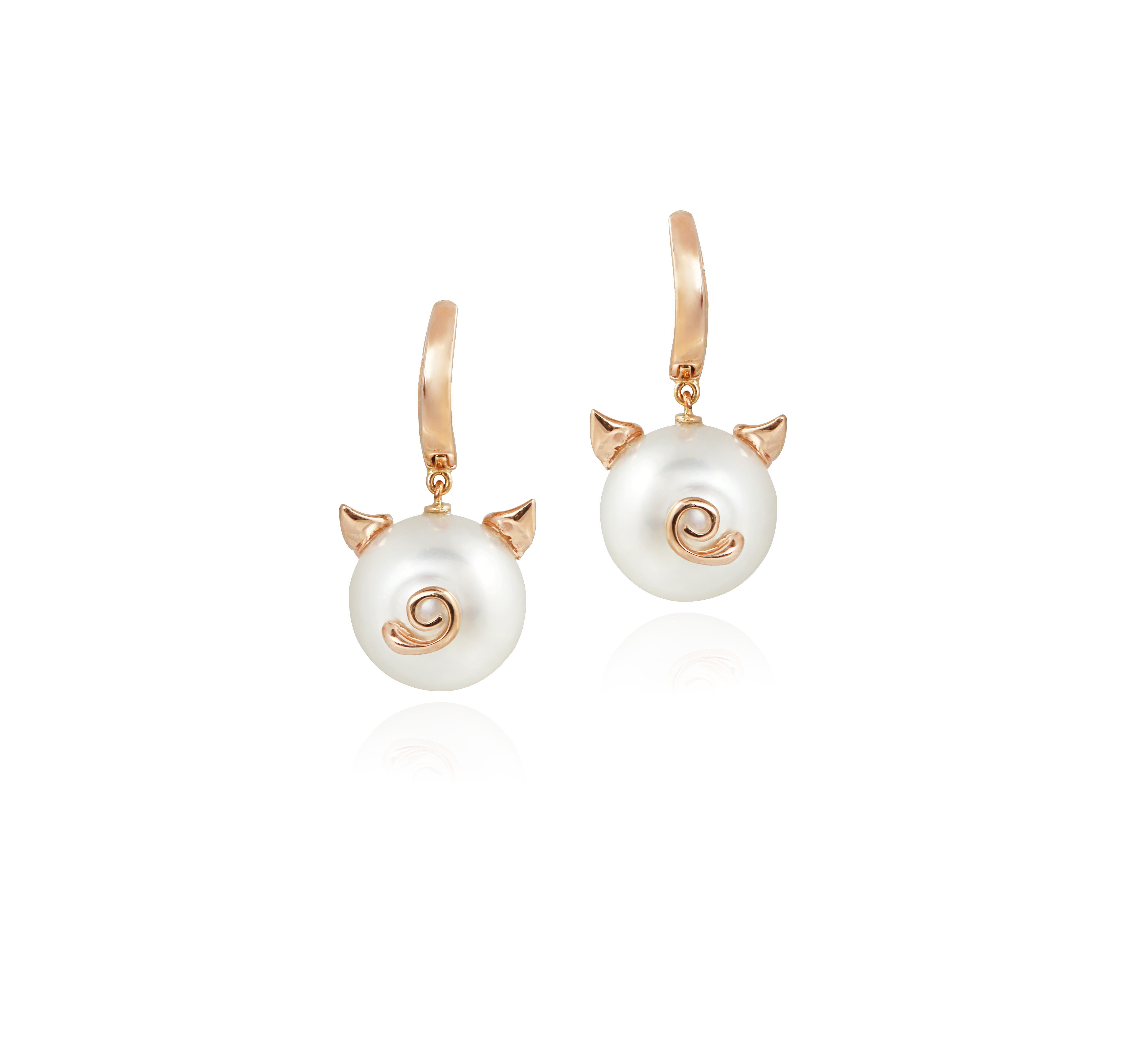 These charming earrings are created using Australian South Sea Pearls measuring 13.8 mm in diameter, and carefully selected clean white diamonds set in 18K rose gold.  A spring back clip makes them easily comfortable to wear.   Very cute and