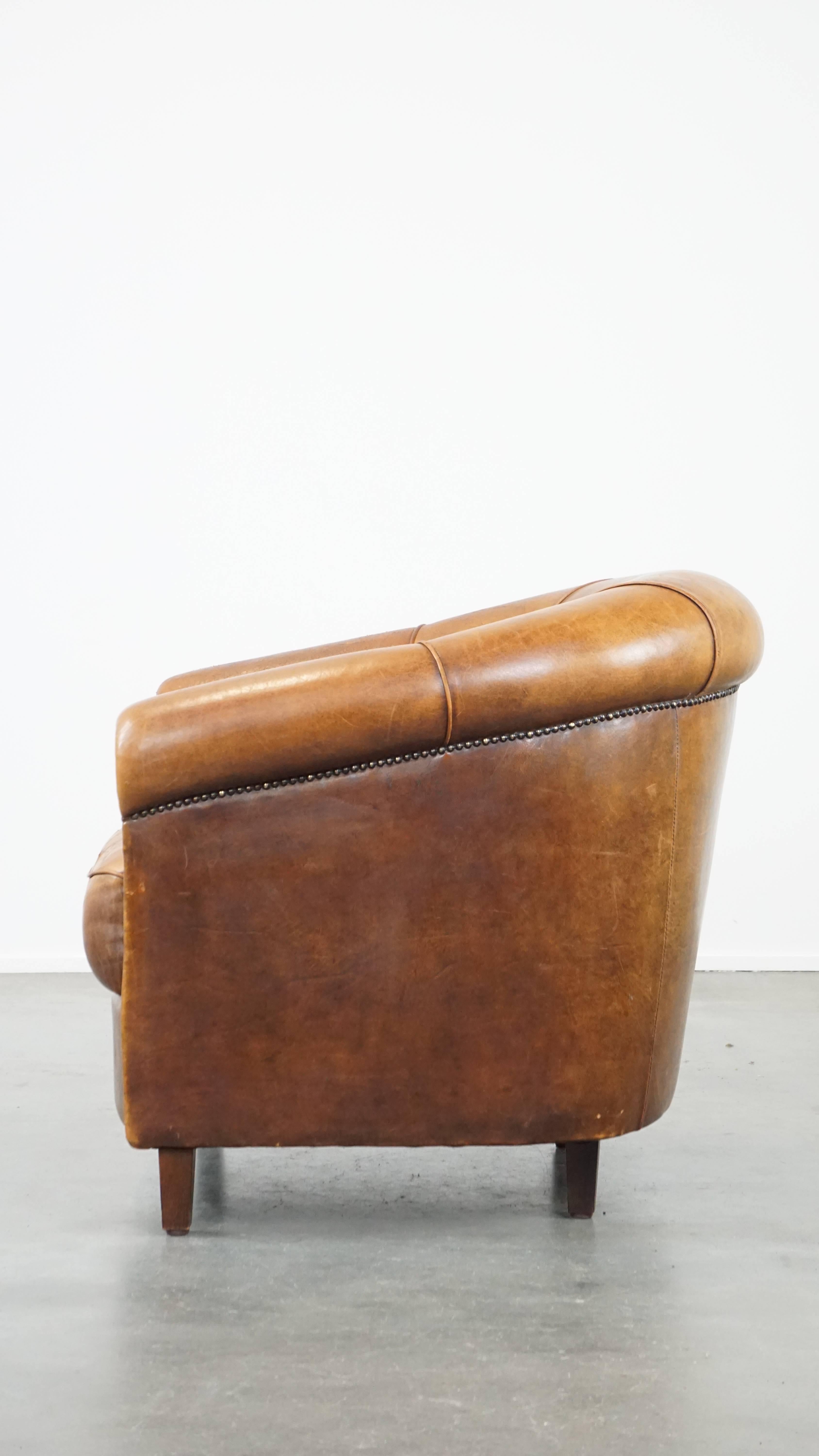 20th Century Charming, sturdy and comfortable cognac-colored sheepskin leather club armchair For Sale